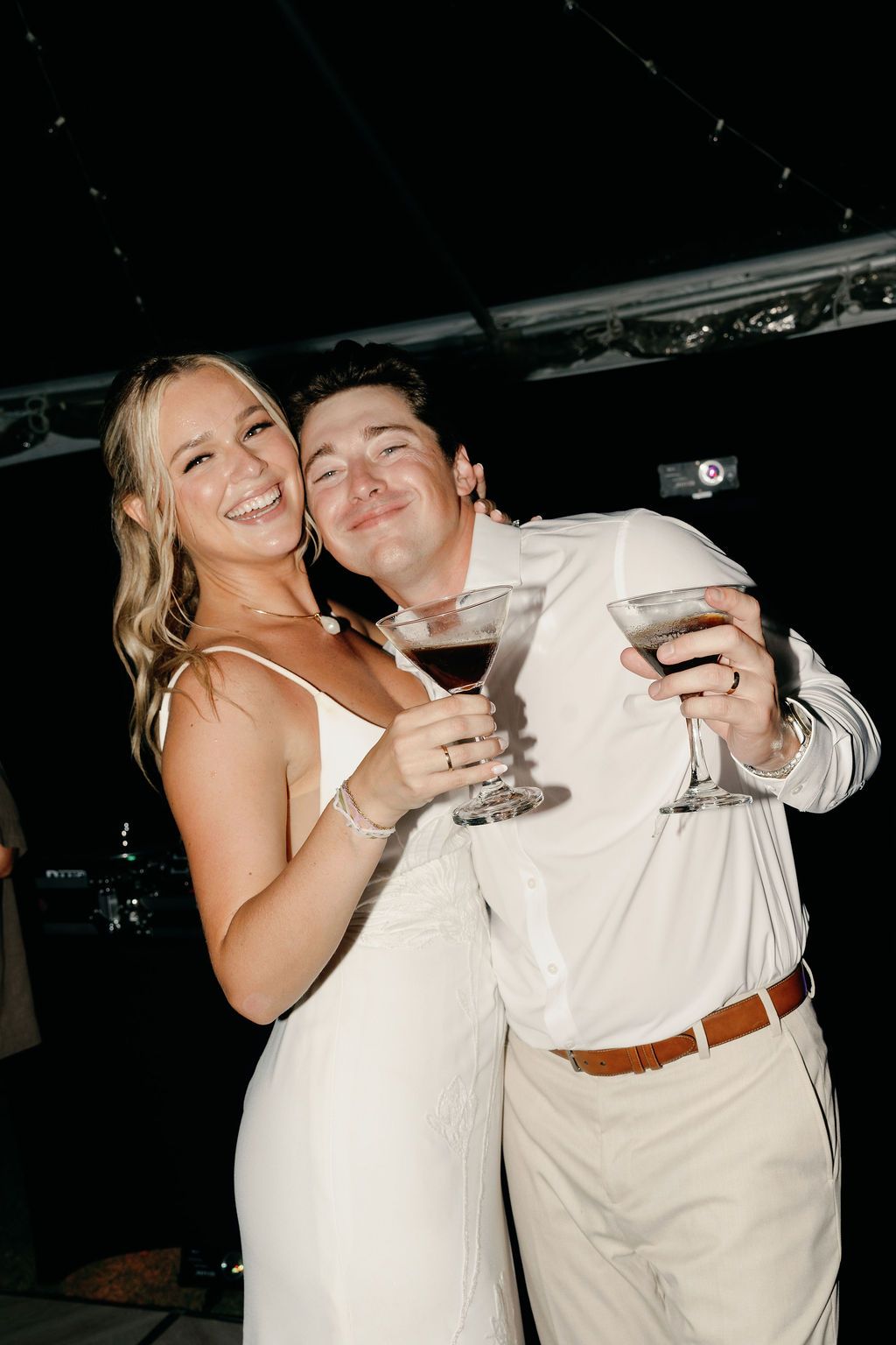 Morgan and Britton sharing drinks during their Hacienda Pinilla wedding reception