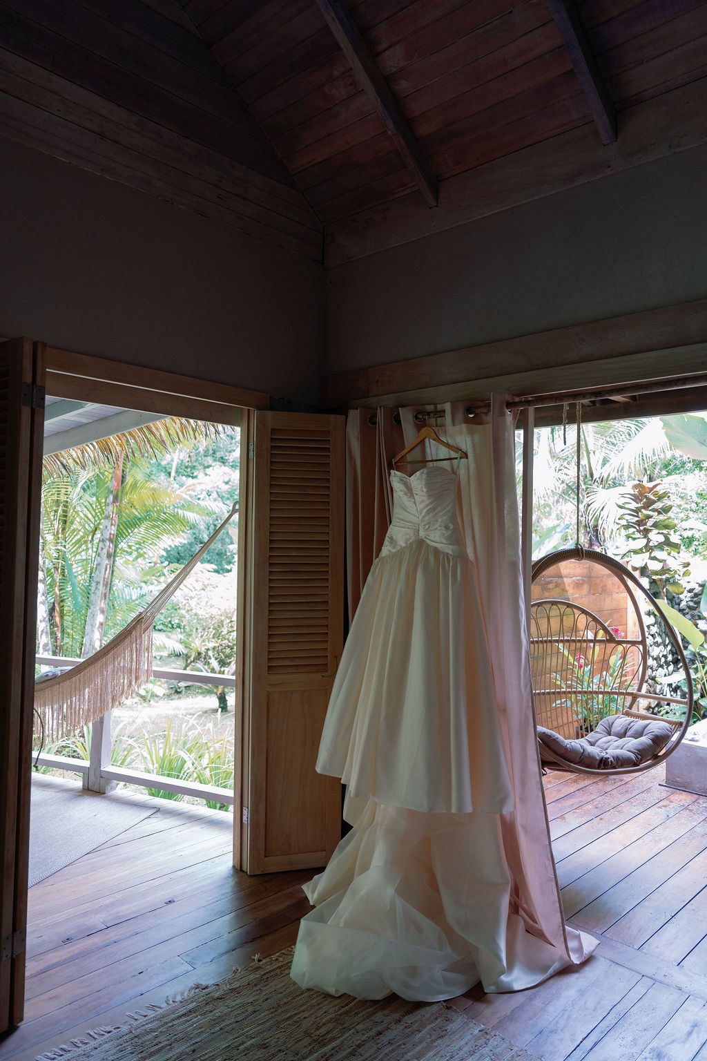 Wedding dress hanging inside a rainforest villa at Golfo Dulce Retreat