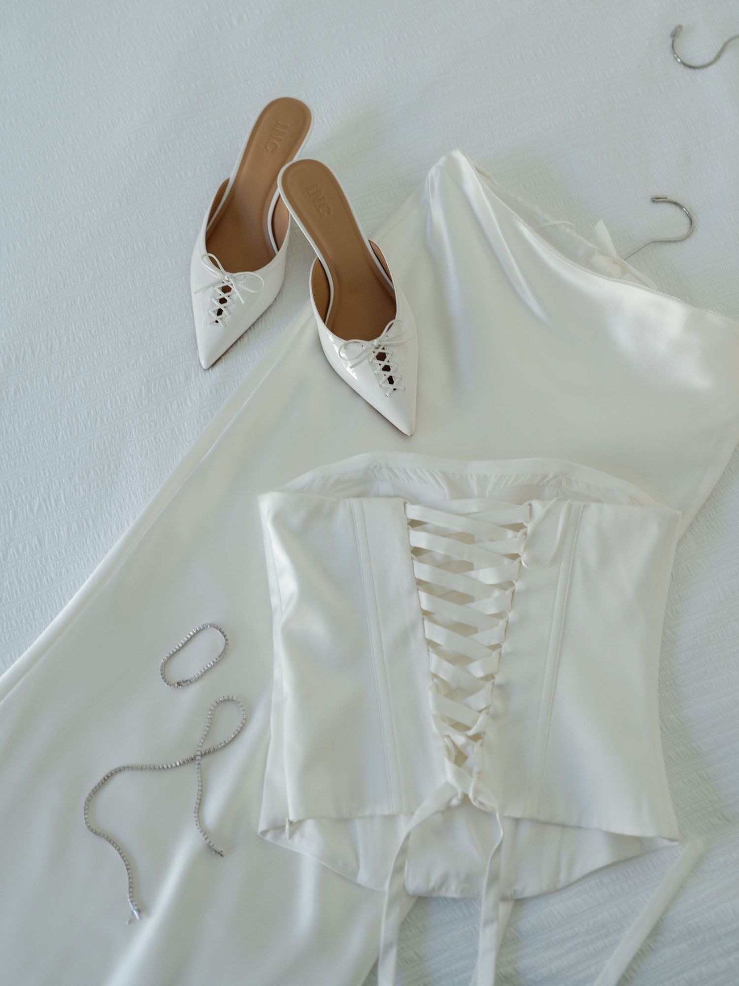 White bridal dress and shoes prepared for a wedding at Hacienda Pinilla in Guanacaste