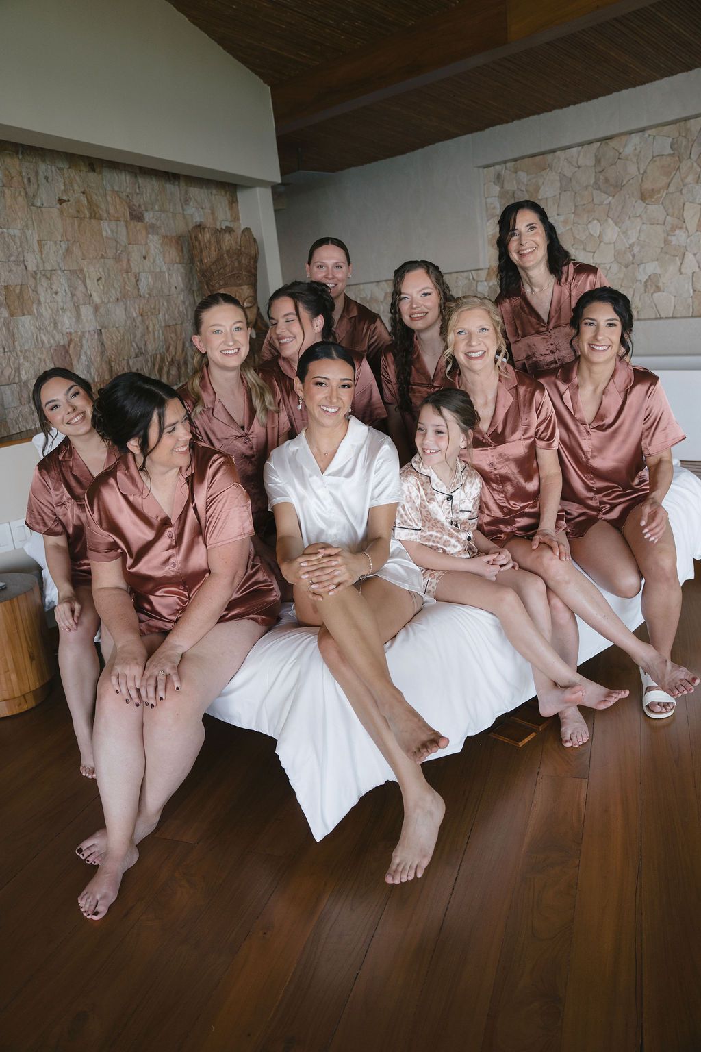 Bride surrounded by friends and family while getting ready at Villa Punto de Vista.