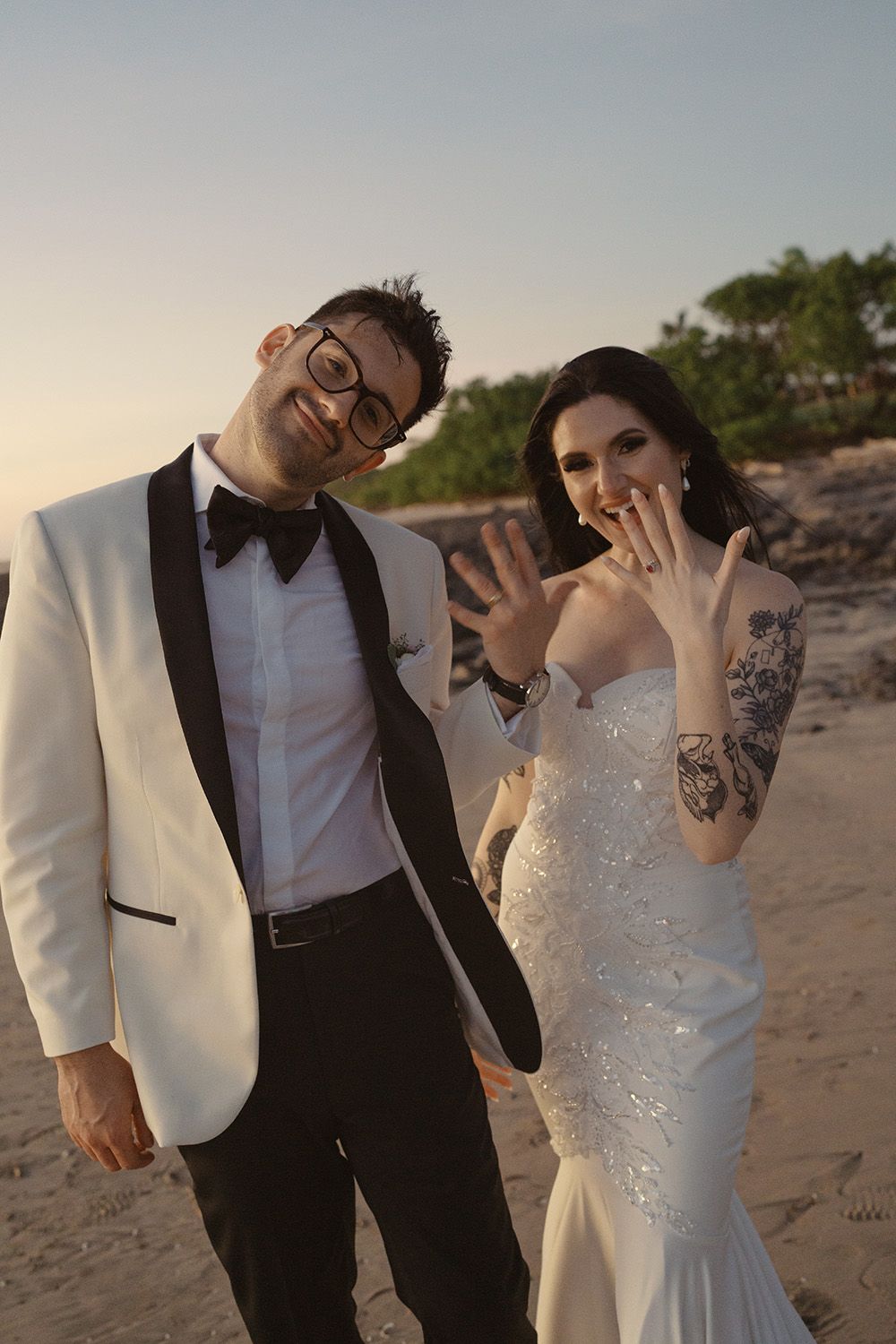 Newlyweds celebrating together during golden hour after their beach wedding in Costa Rica.