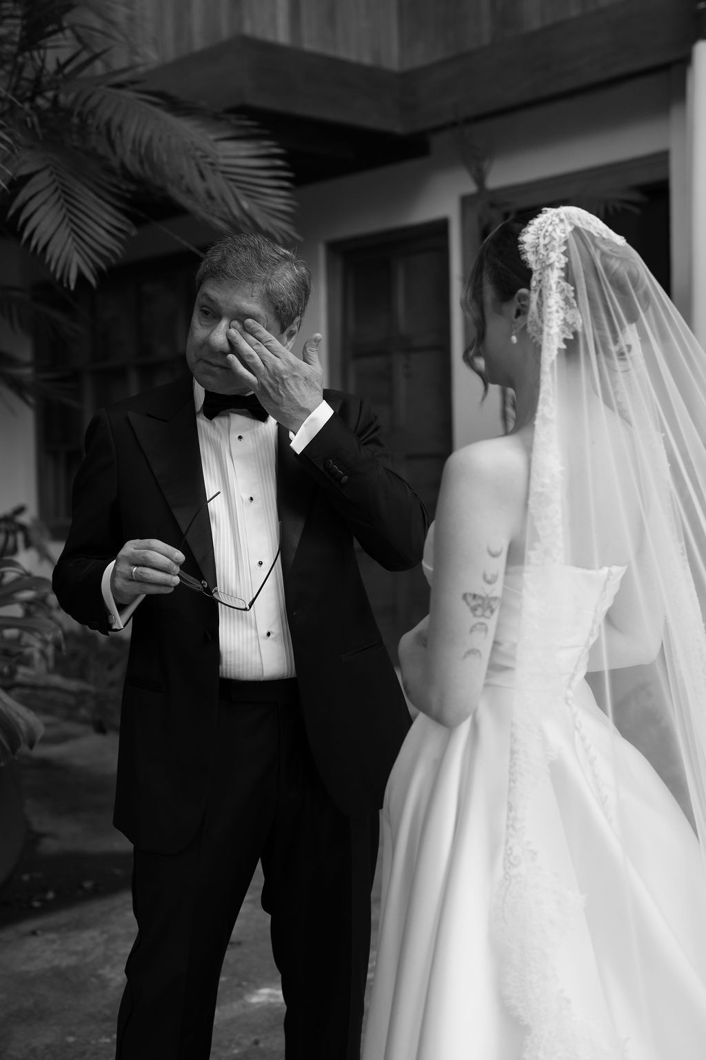Emotional father seeing his daughter as a bride before her wedding ceremony