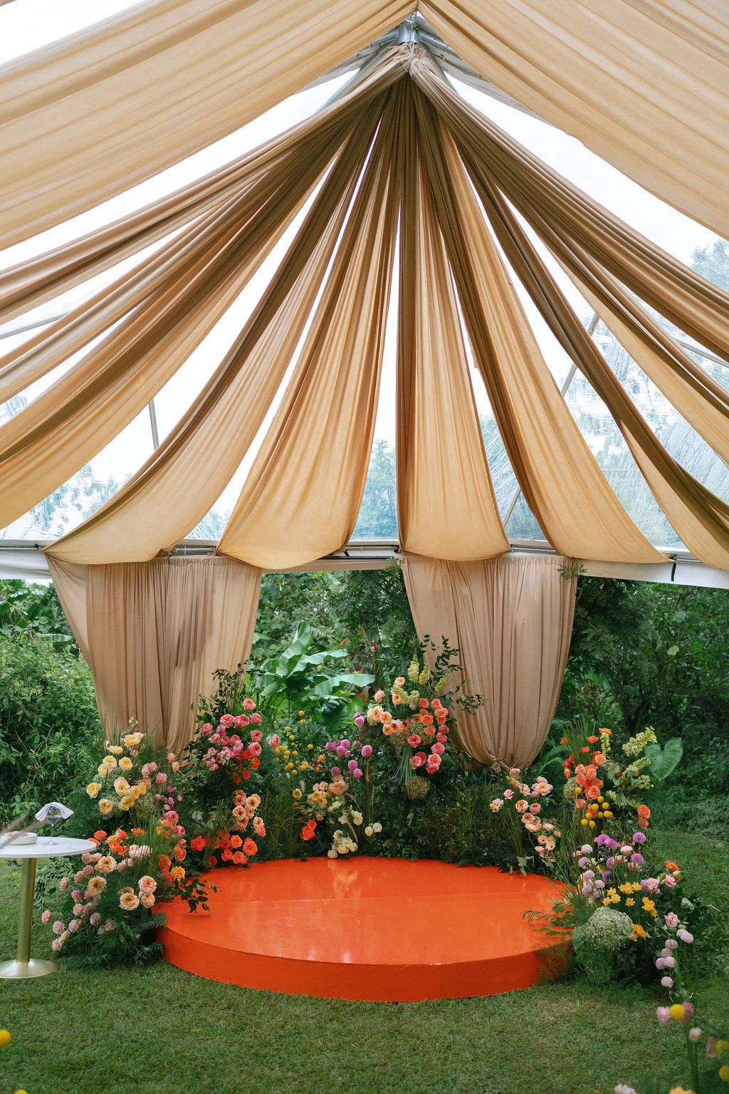 Colorful floral ceremony installation surrounded by rainforest in Costa Rica