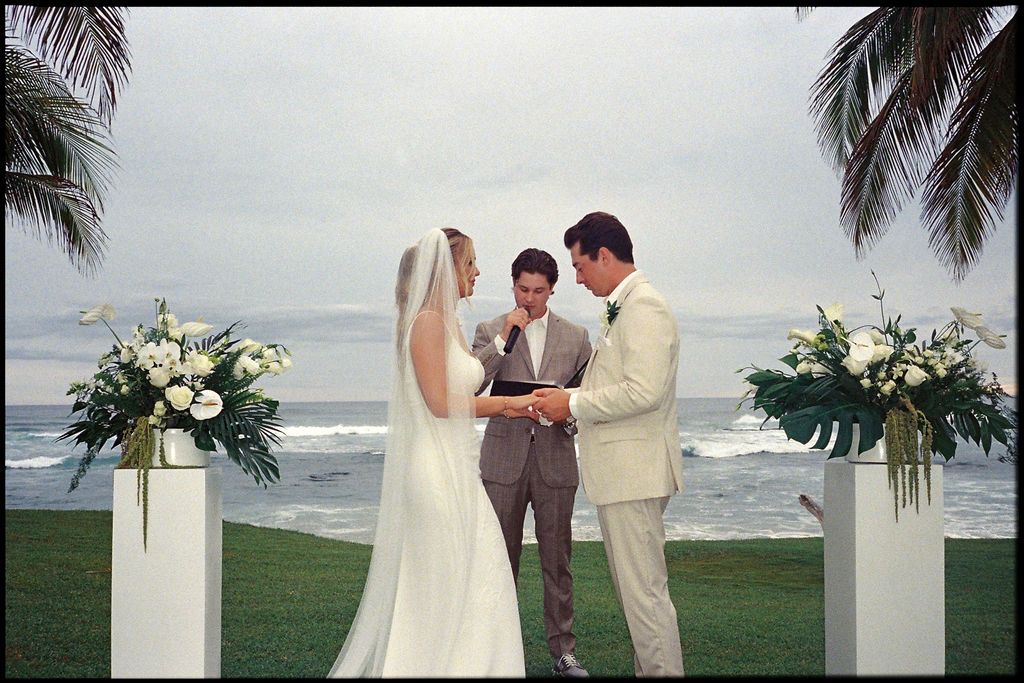 Morgan and Britton exchanging vows during their oceanfront ceremony at Las Palapas