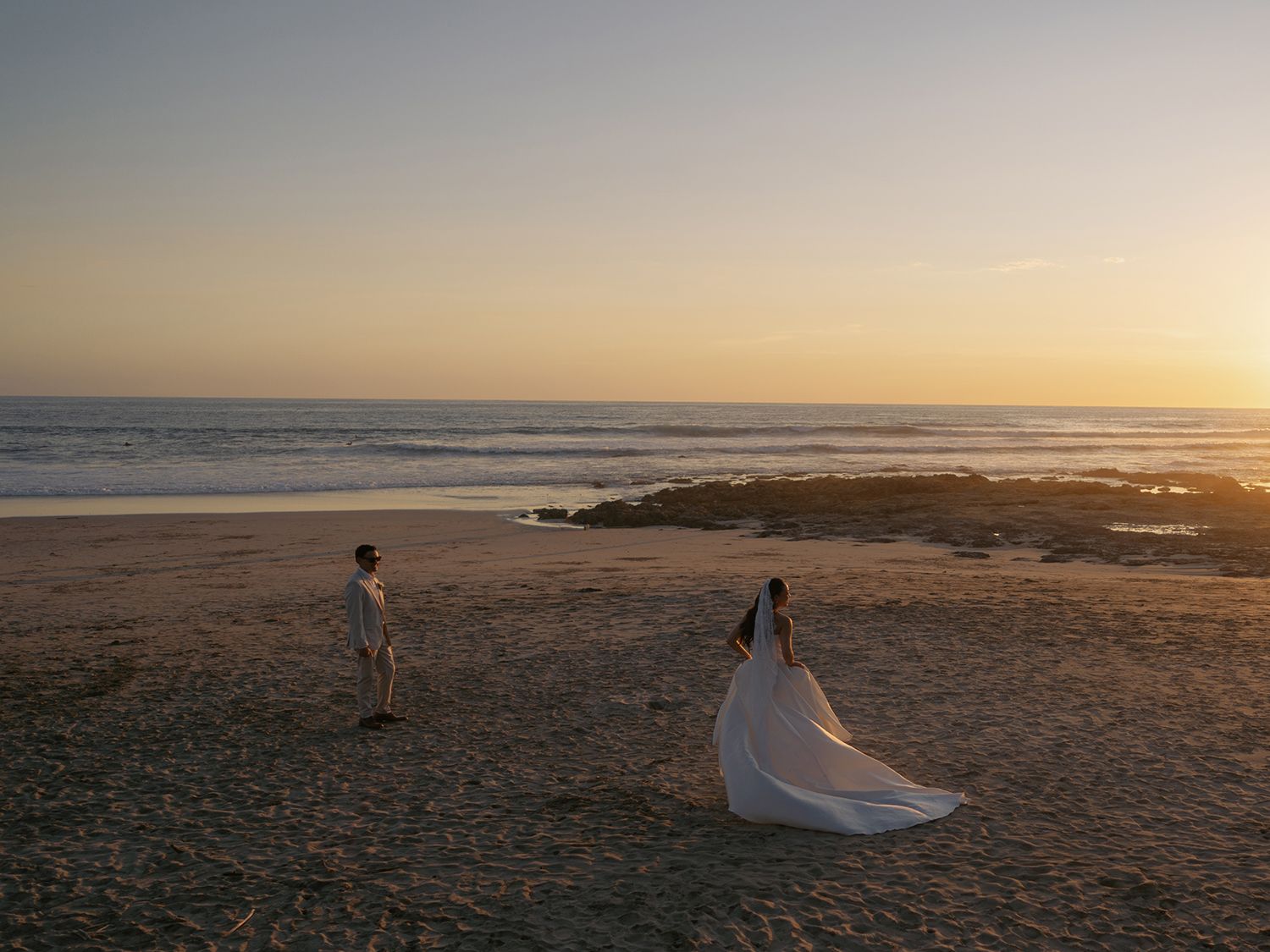 Newlyweds photographed at sunset during their wedding weekend in Guanacaste, Costa Rica.