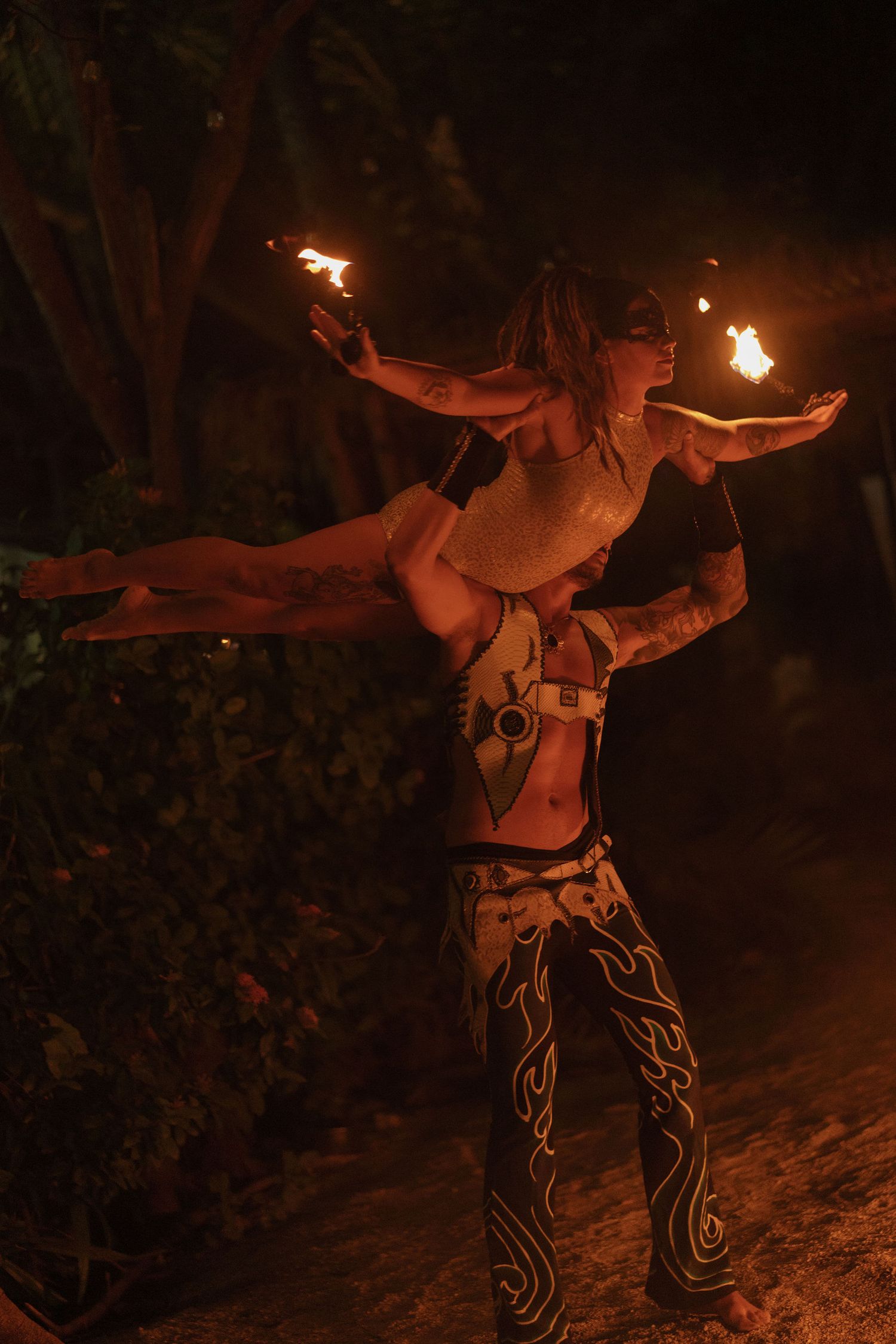 Fire performers entertaining guests during a wedding welcome party in Tamarindo, Costa Rica
