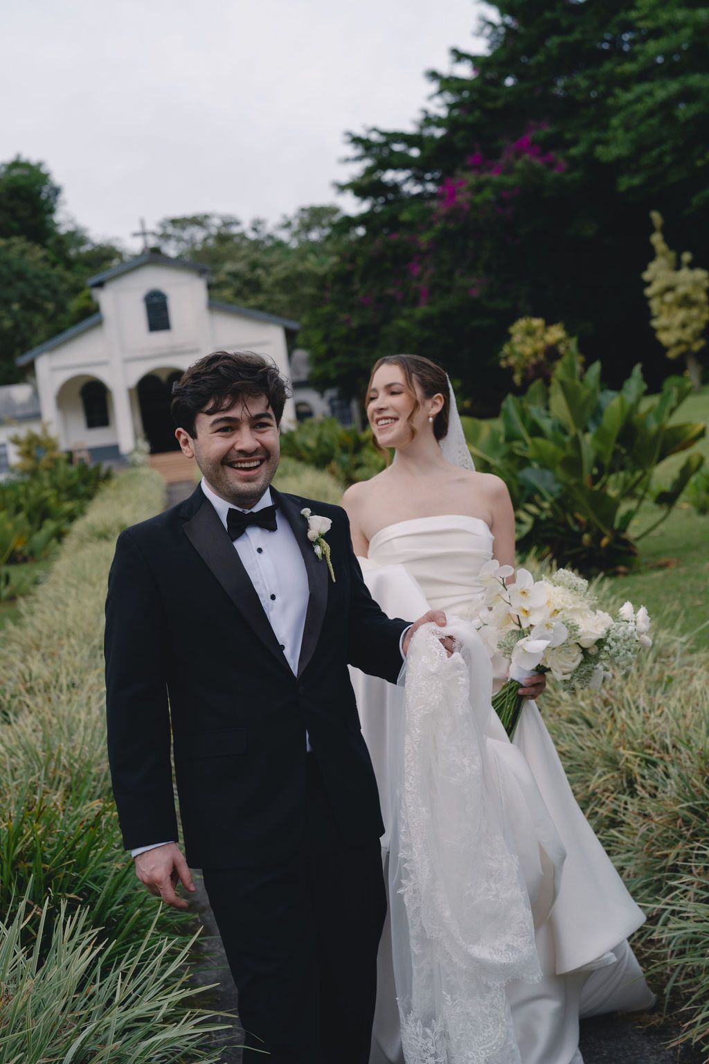 Newlyweds walking together after their church wedding in Monteverde, Costa Rica