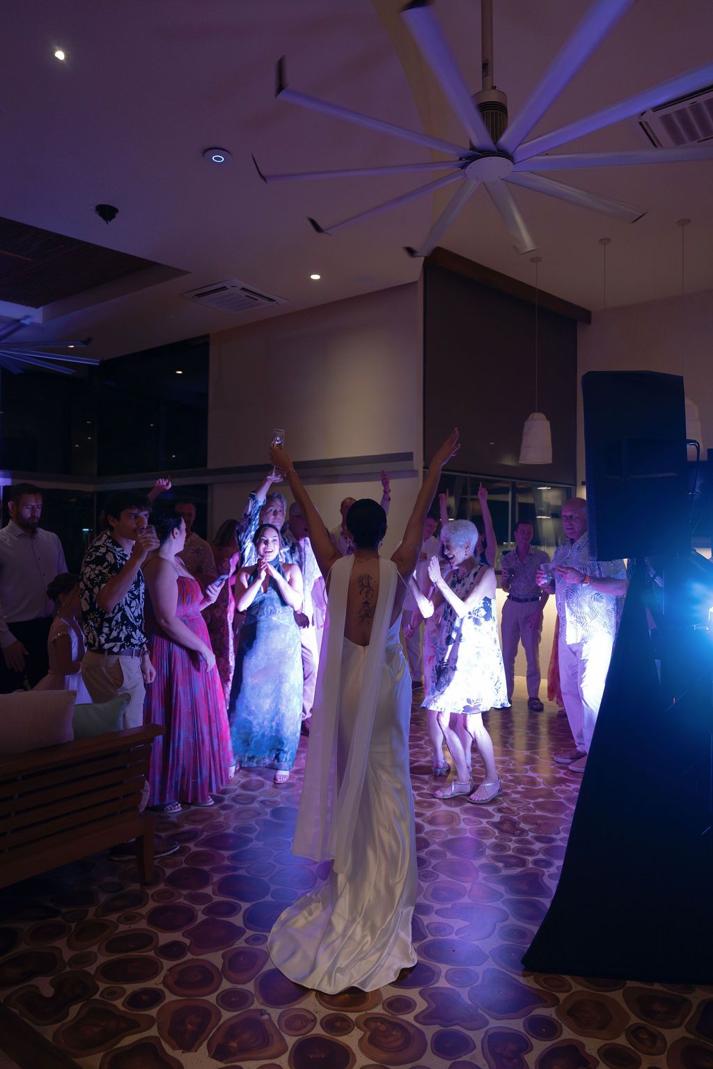 Bride celebrating on the dance floor with guests during an intimate wedding reception at Villa Punto de Vista.