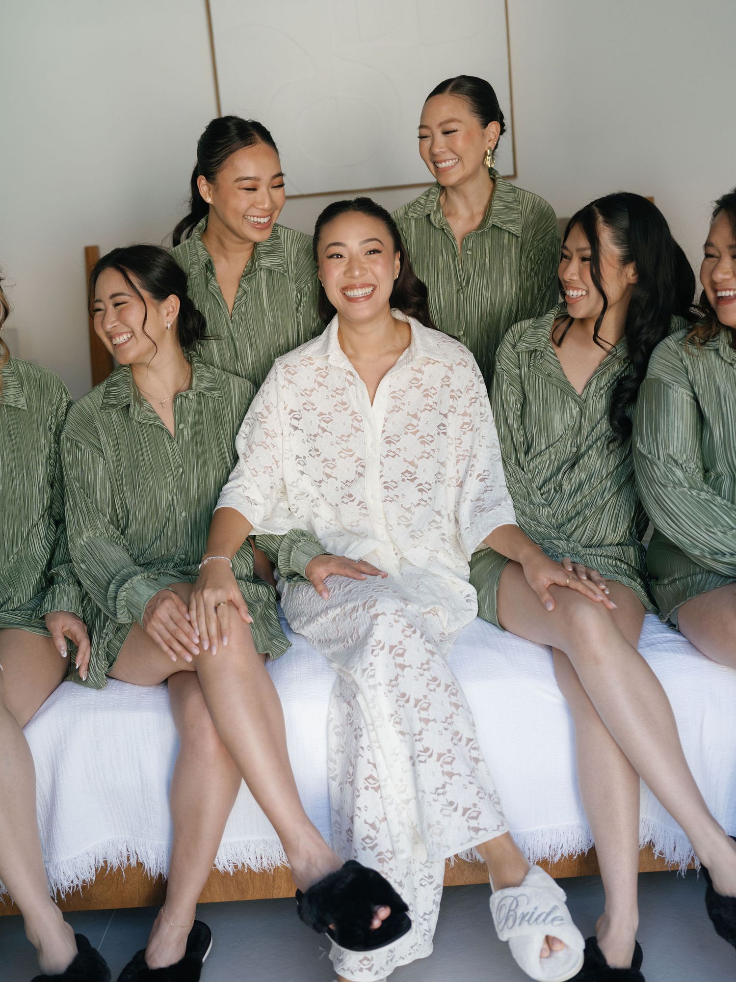 Bride laughing with her bridesmaids while getting ready for her Hacienda Pinilla wedding