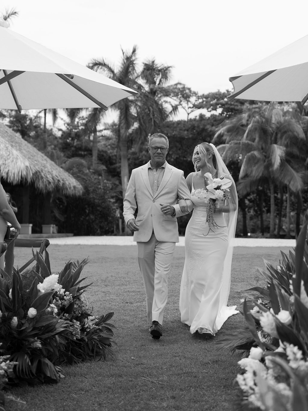 Bride walking down the aisle with her father at Las Palapas, Hacienda Pinilla