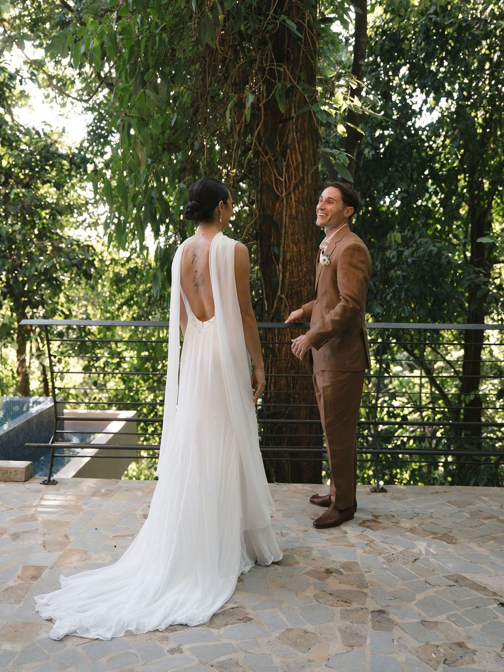 Couple seeing each other during their first look in the rainforest at Villa Punto de Vista.