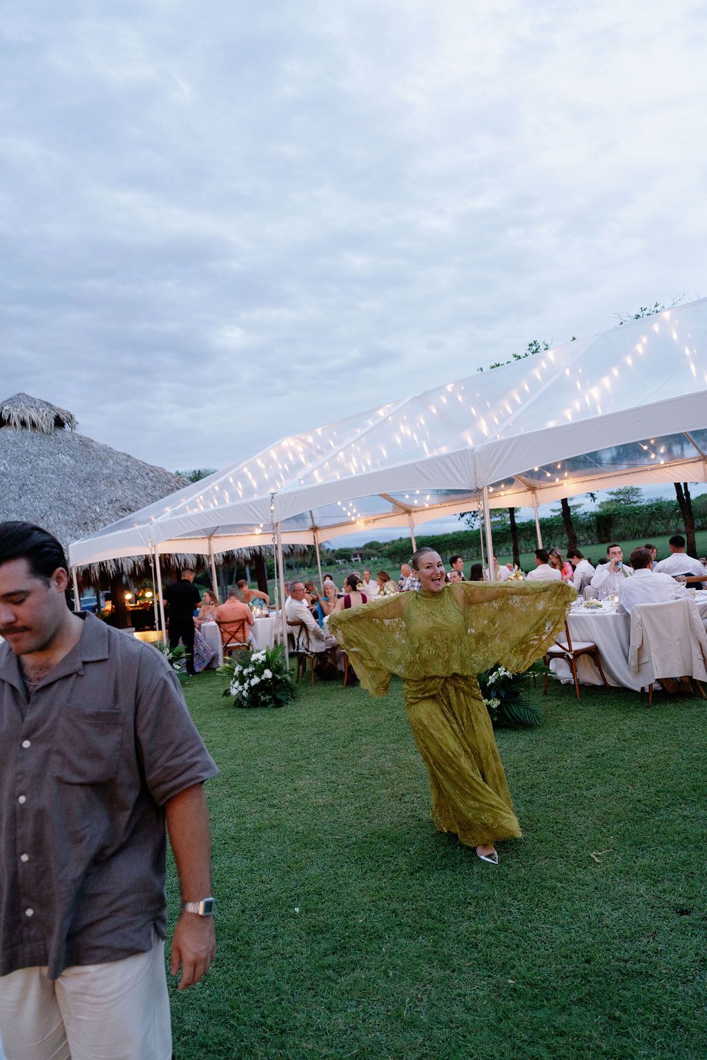 Candid guest moment during the outdoor reception at Las Palapas