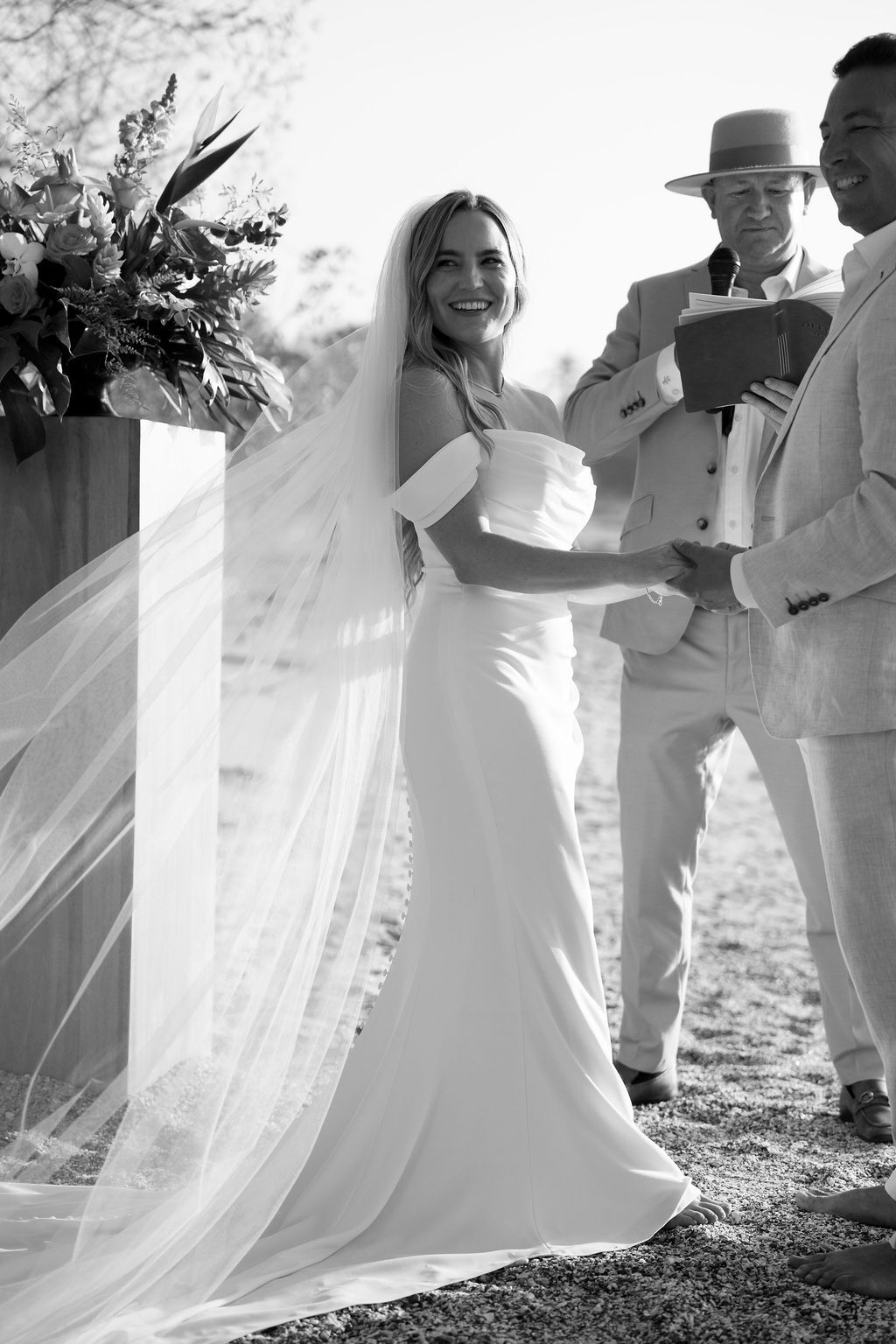 Smiling bride with the groom during an outdoor wedding ceremony in nosara, costa rica