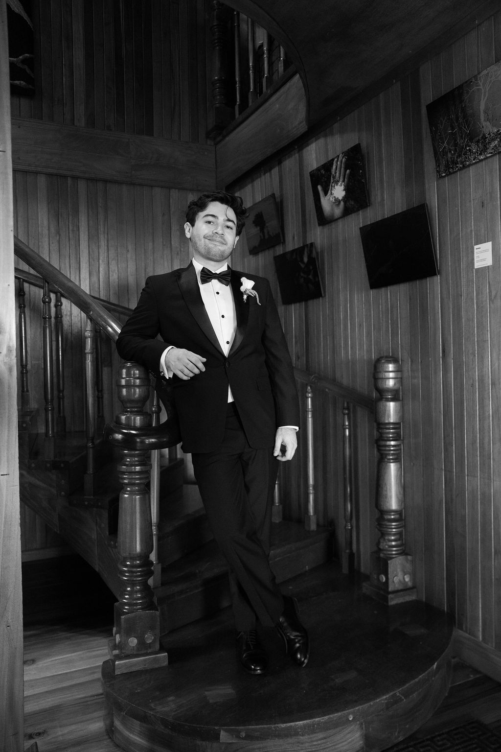Black and white portrait of the groom in a tuxedo before his Monteverde wedding