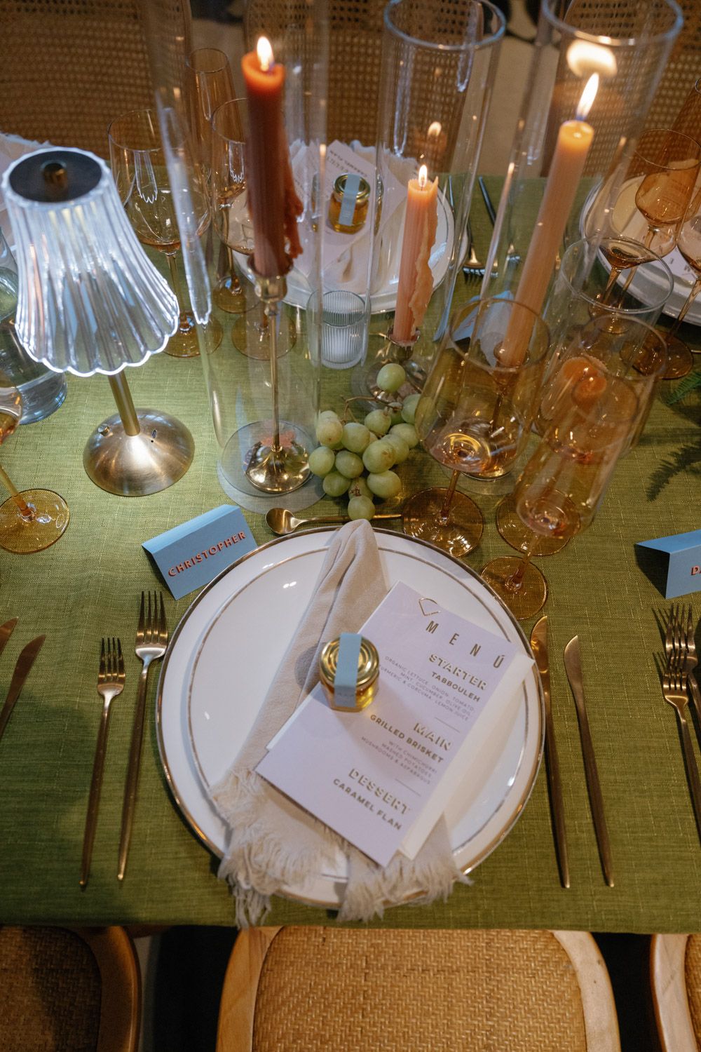 Elegant wedding table setting with flowers and candles at an outdoor reception