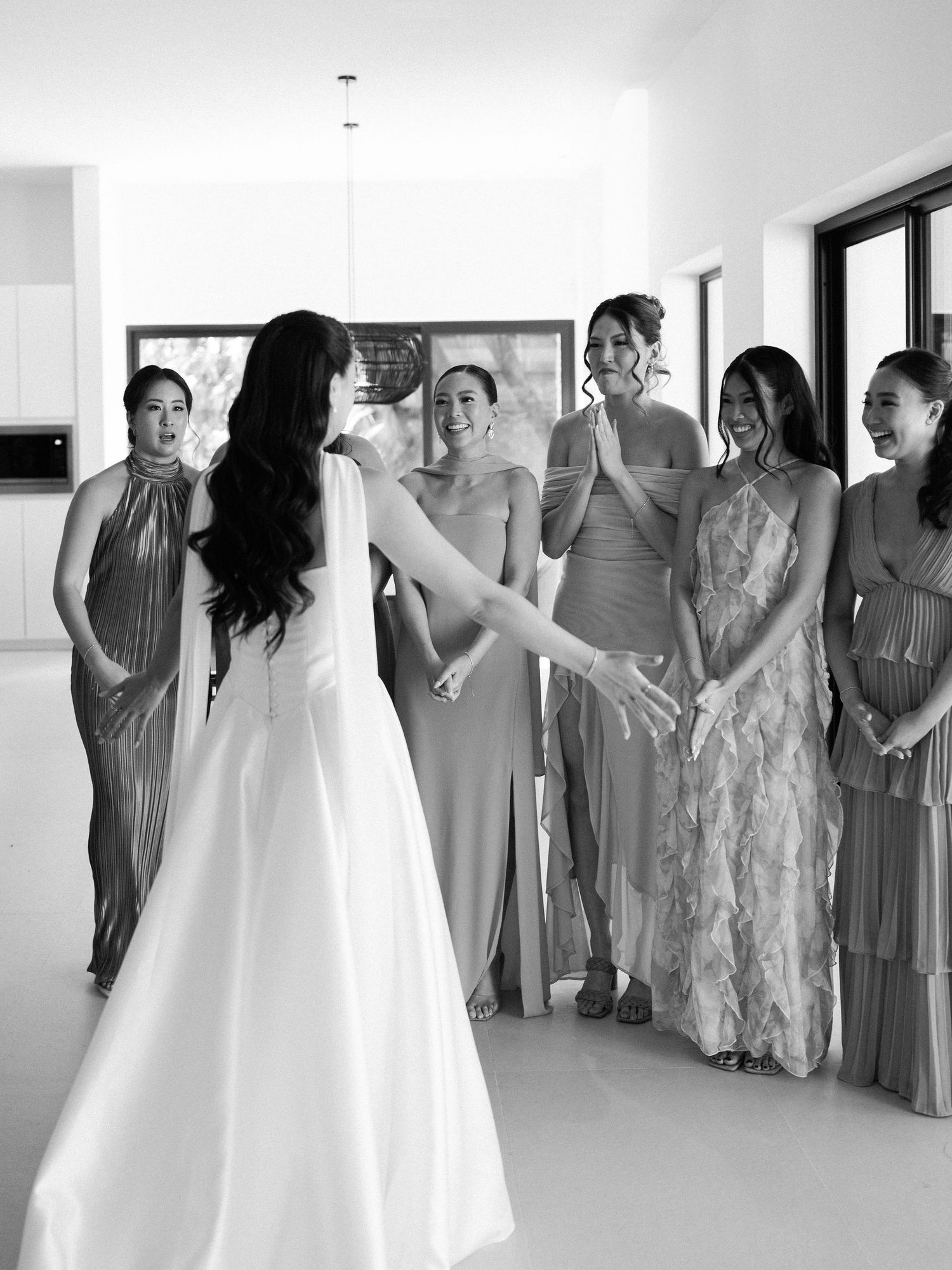 Bridesmaids reacting as they see the bride dressed for her Hacienda Pinilla wedding