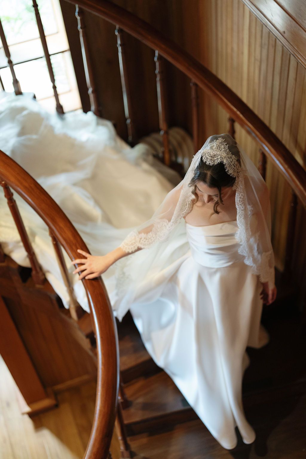 Bride walking down a wooden staircase before her wedding in Costa Rica.
