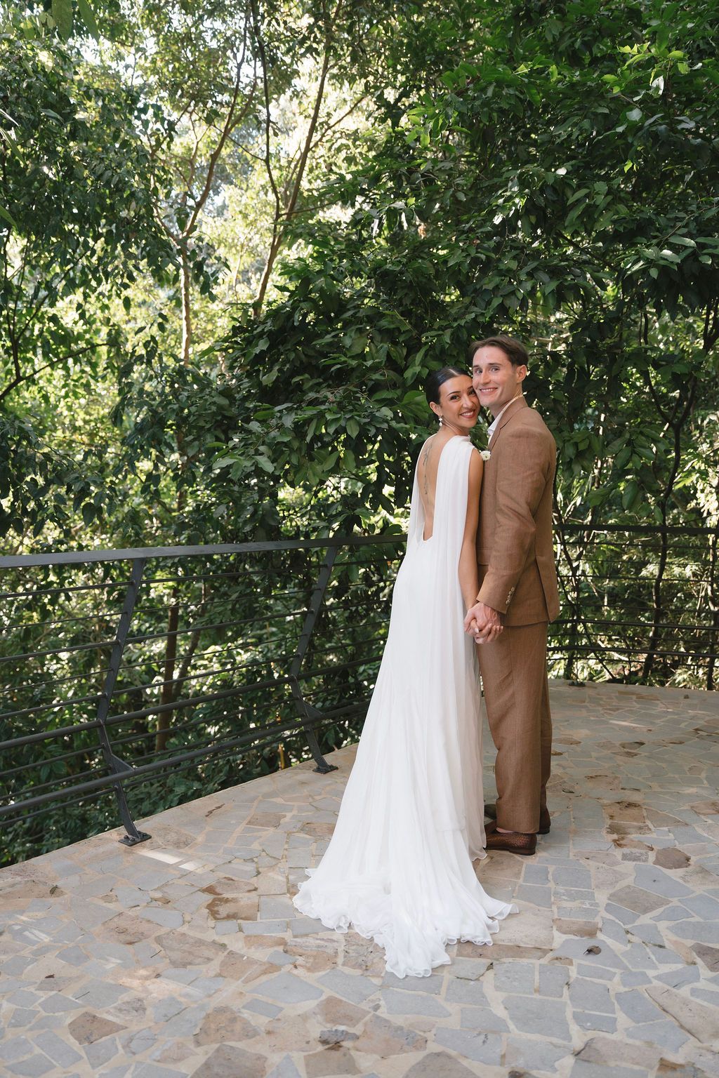 Couple standing together among the tropical rainforest in Manuel Antonio, Costa Rica.