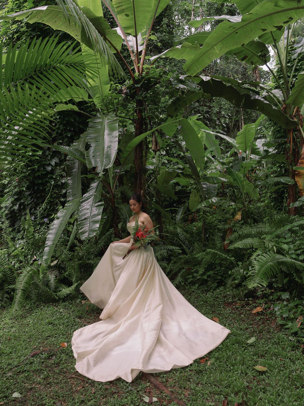 Bridal portrait among giant tropical leaves at Golfo Dulce Retreat in Costa Rica