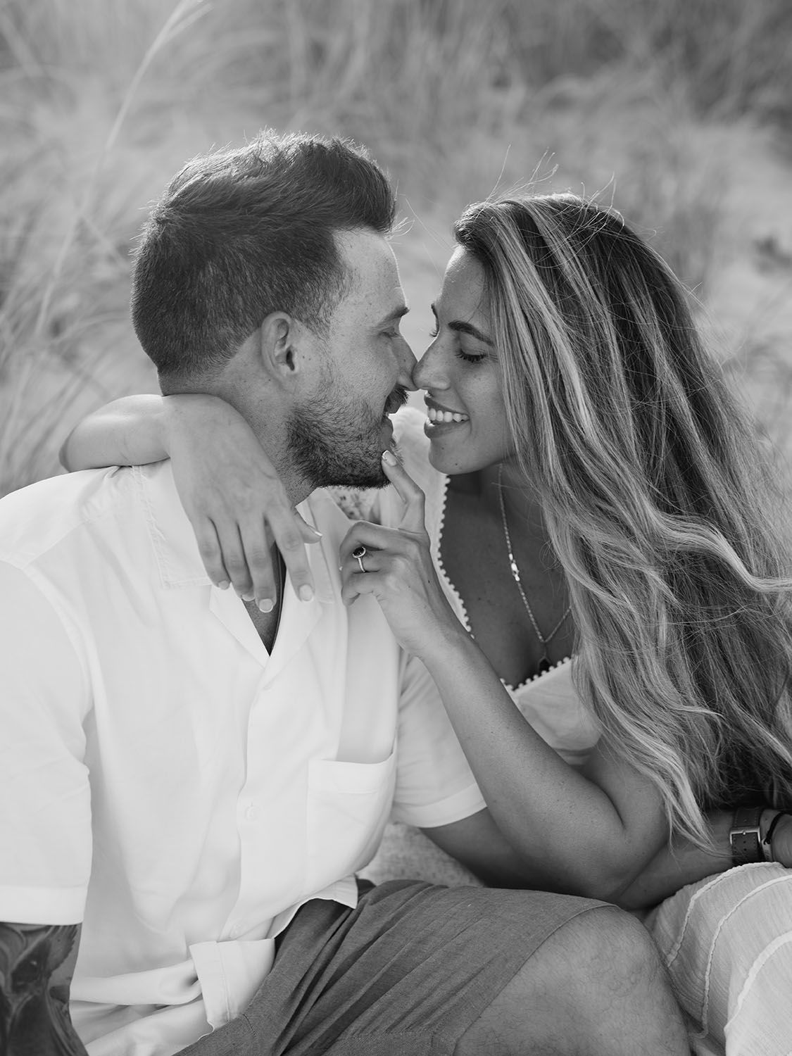 Couple sharing an intimate moment during their engagement session in Costa Rica.