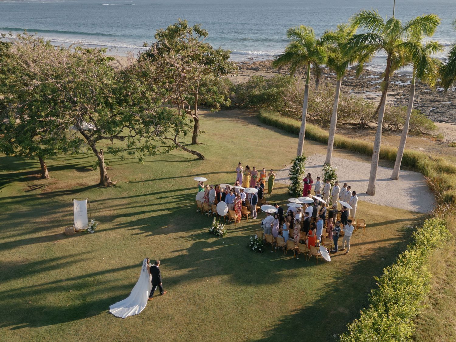 Aerial view of Ashley and Ryan's beach wedding ceremony at Hacienda Pinilla in Guanacaste