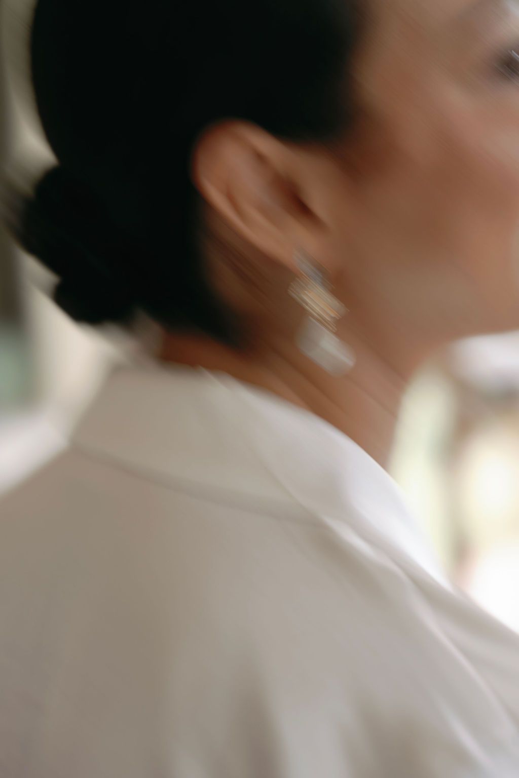 Soft-focus detail of the bride's earrings while getting ready in Manuel Antonio.