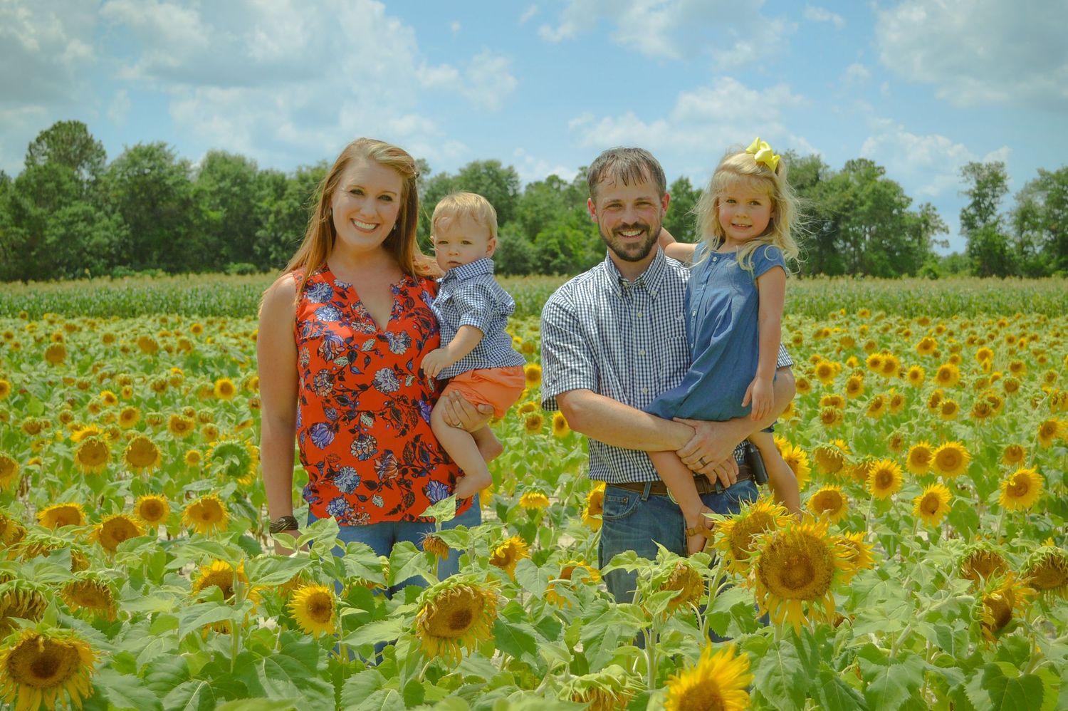 Beautiful outdoor natural light family session set in a sunflower field - Clinton Sease Farms in SC