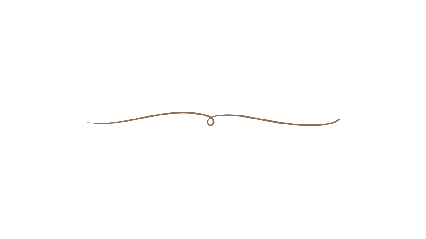 Delicate copper-colored decorative scroll design on black background.