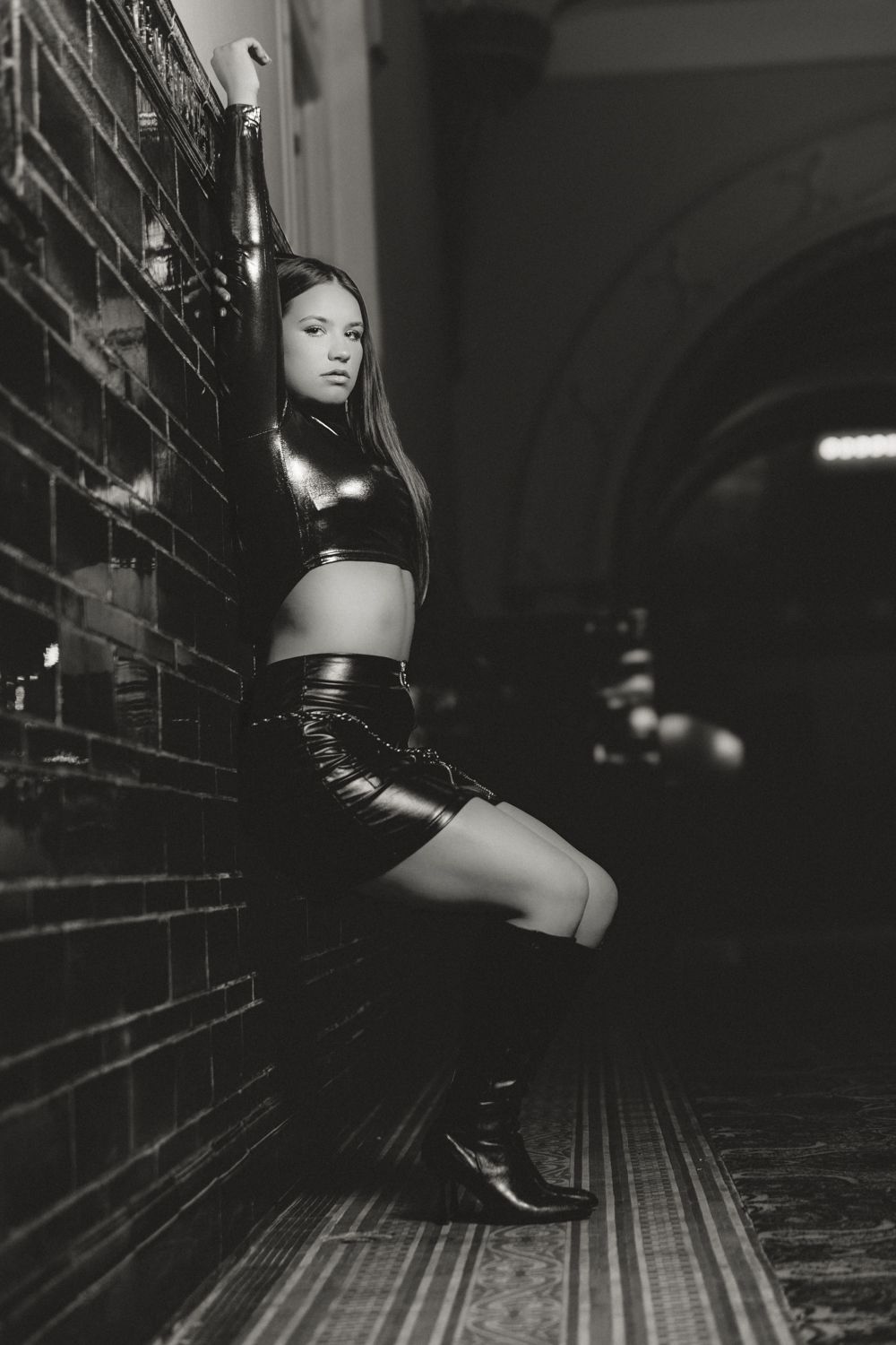 Artistic black and white photo series showing progressive movement of a person in boots along a dark corridor.