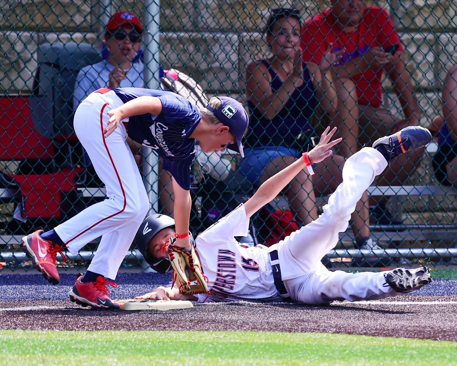 Baseball player slides into home plate during intense game action sequence shown in multiple frames.
