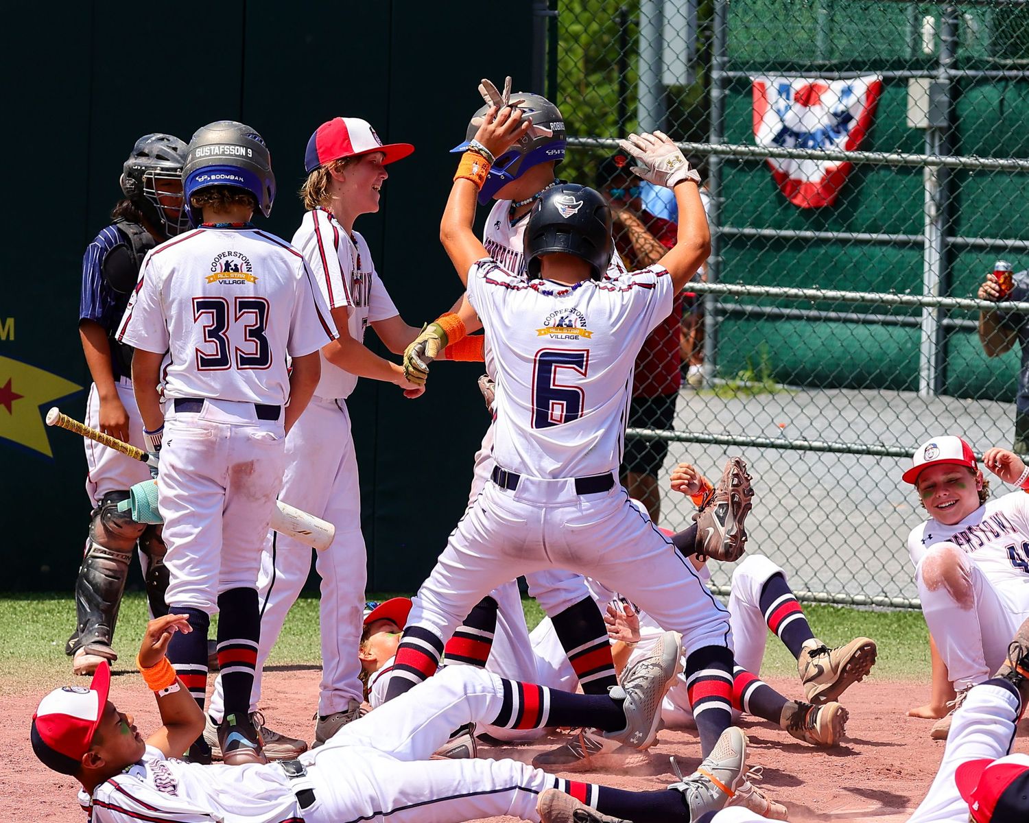 Baseball player slides into home plate during intense game action sequence shown in multiple connected frames.
