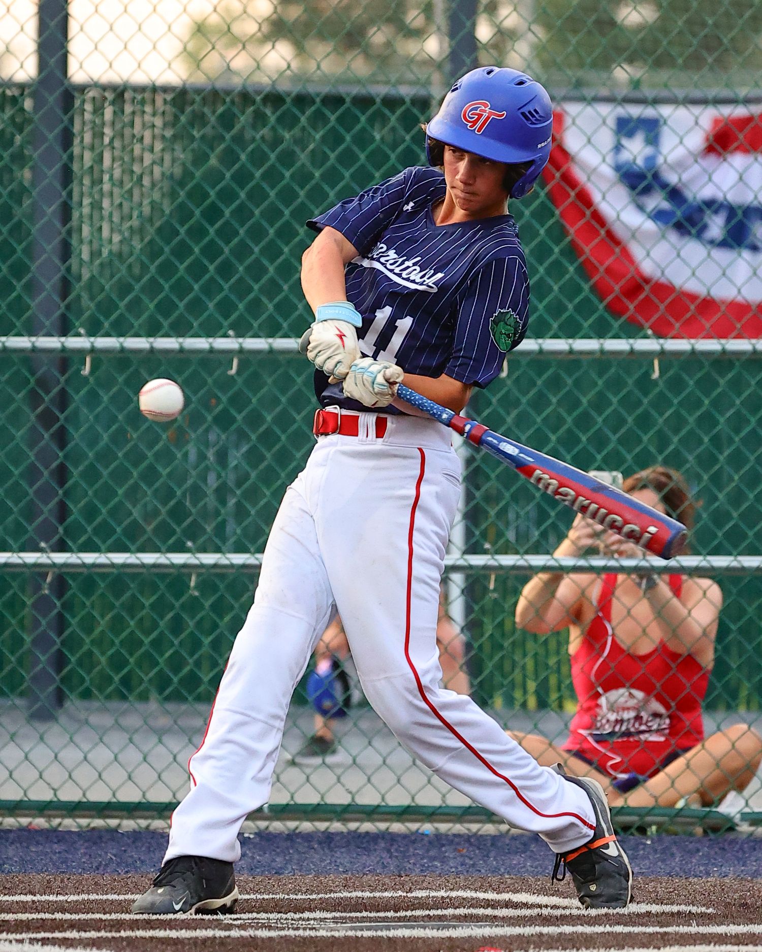 Baseball player bunts the ball during a youth baseball game showing sequence of the bunt attempt in action.