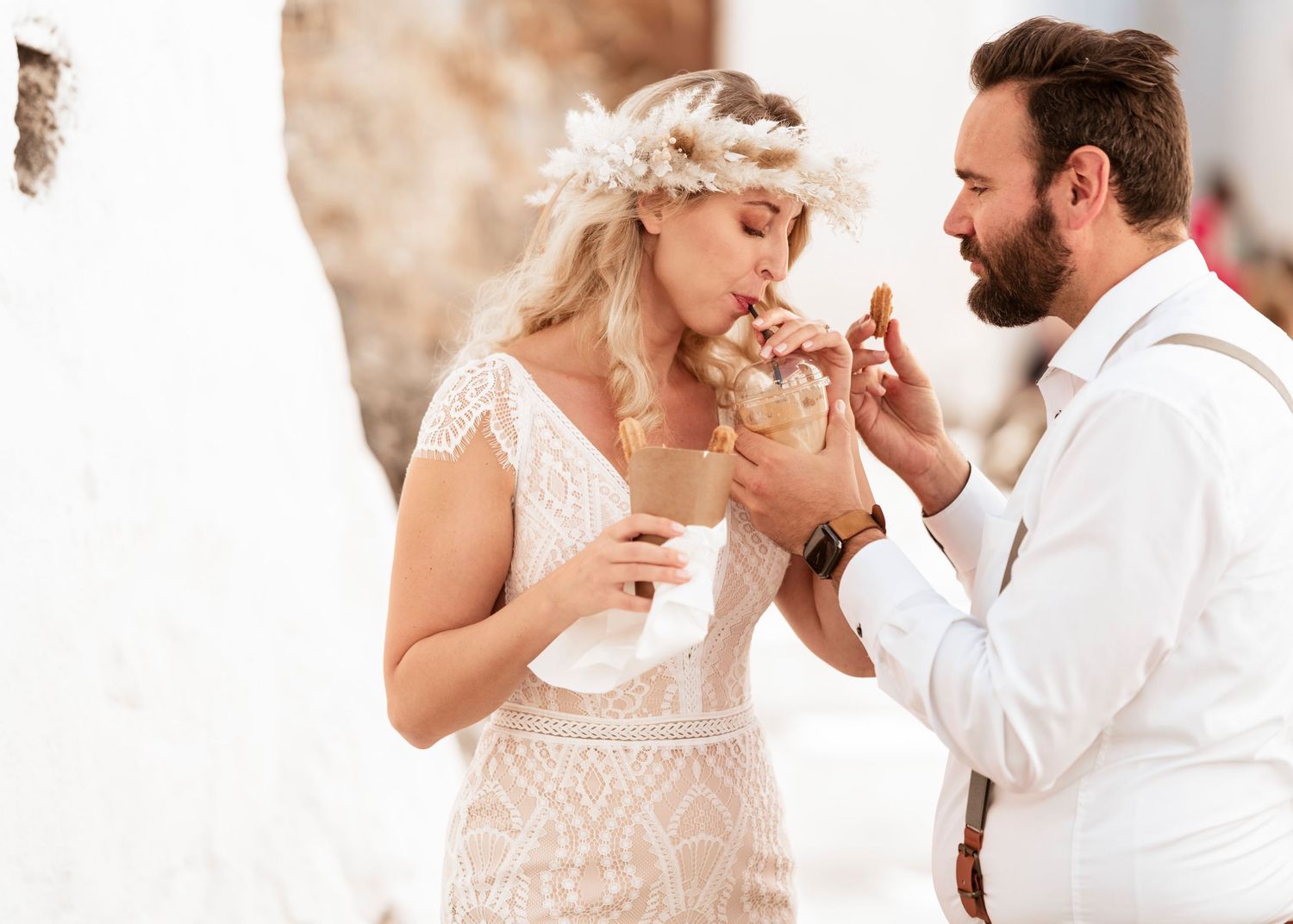 Candid moments of newlyweds sharing sweets and laughter in warm natural lighting.hochzeitsfotograf Griechenland - Hochzeitsfotograf Rhodos T