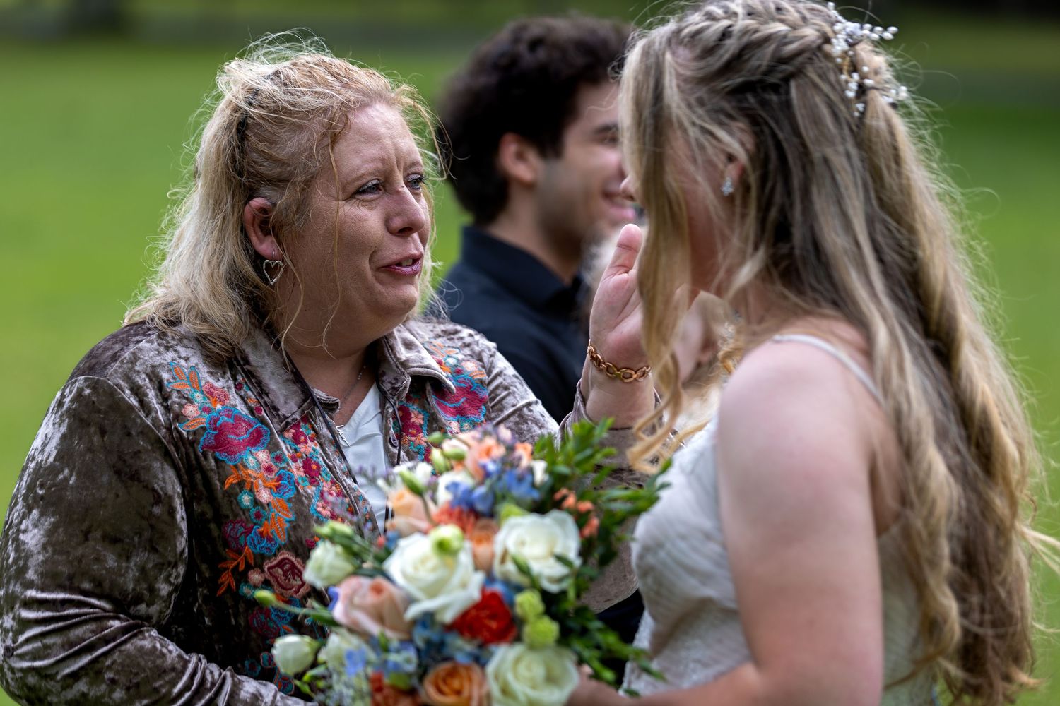 Mother-in-law receives her new  daughter-in-law at the wedding.