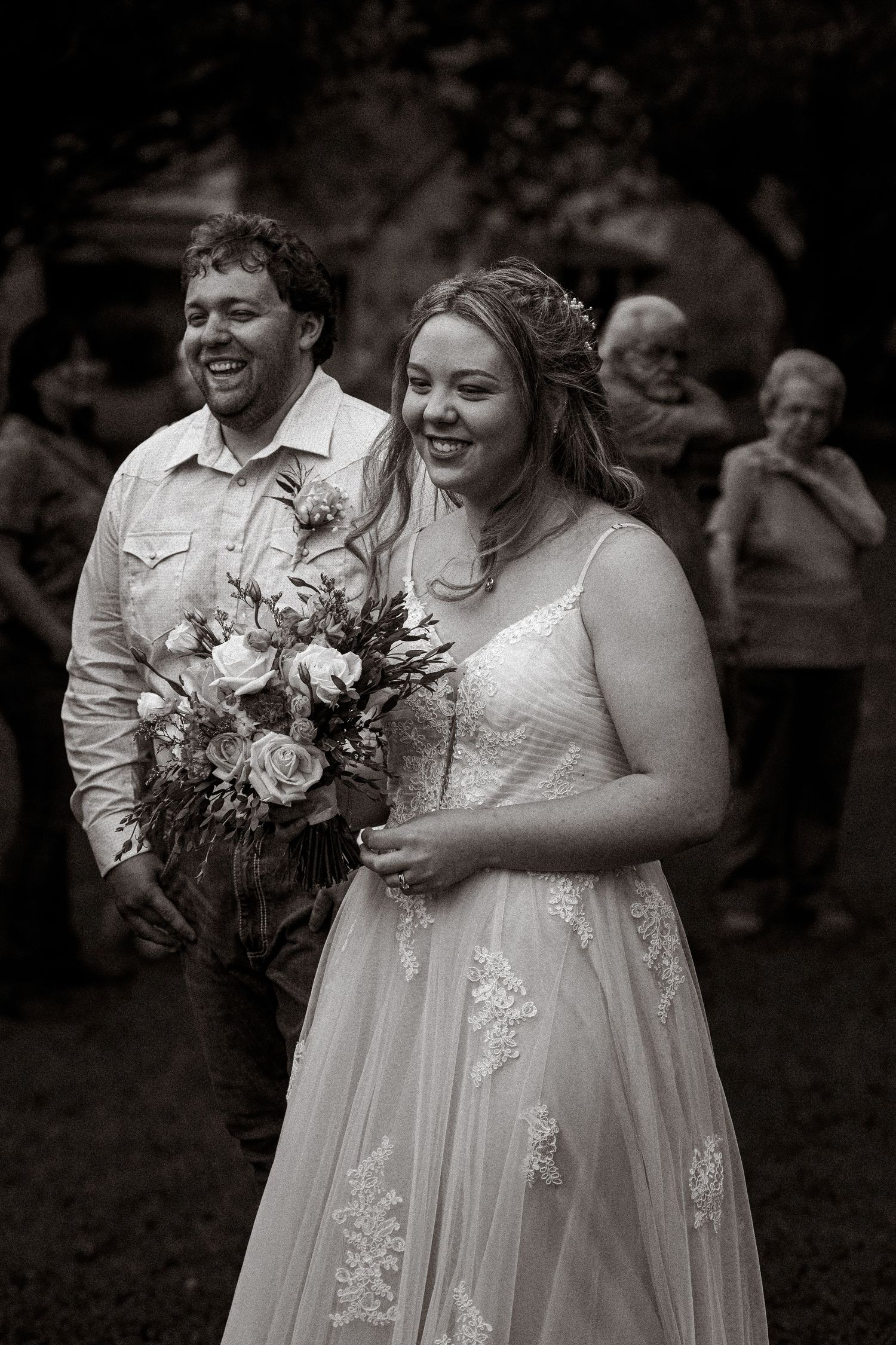 Bride and Groom surrounded by their family