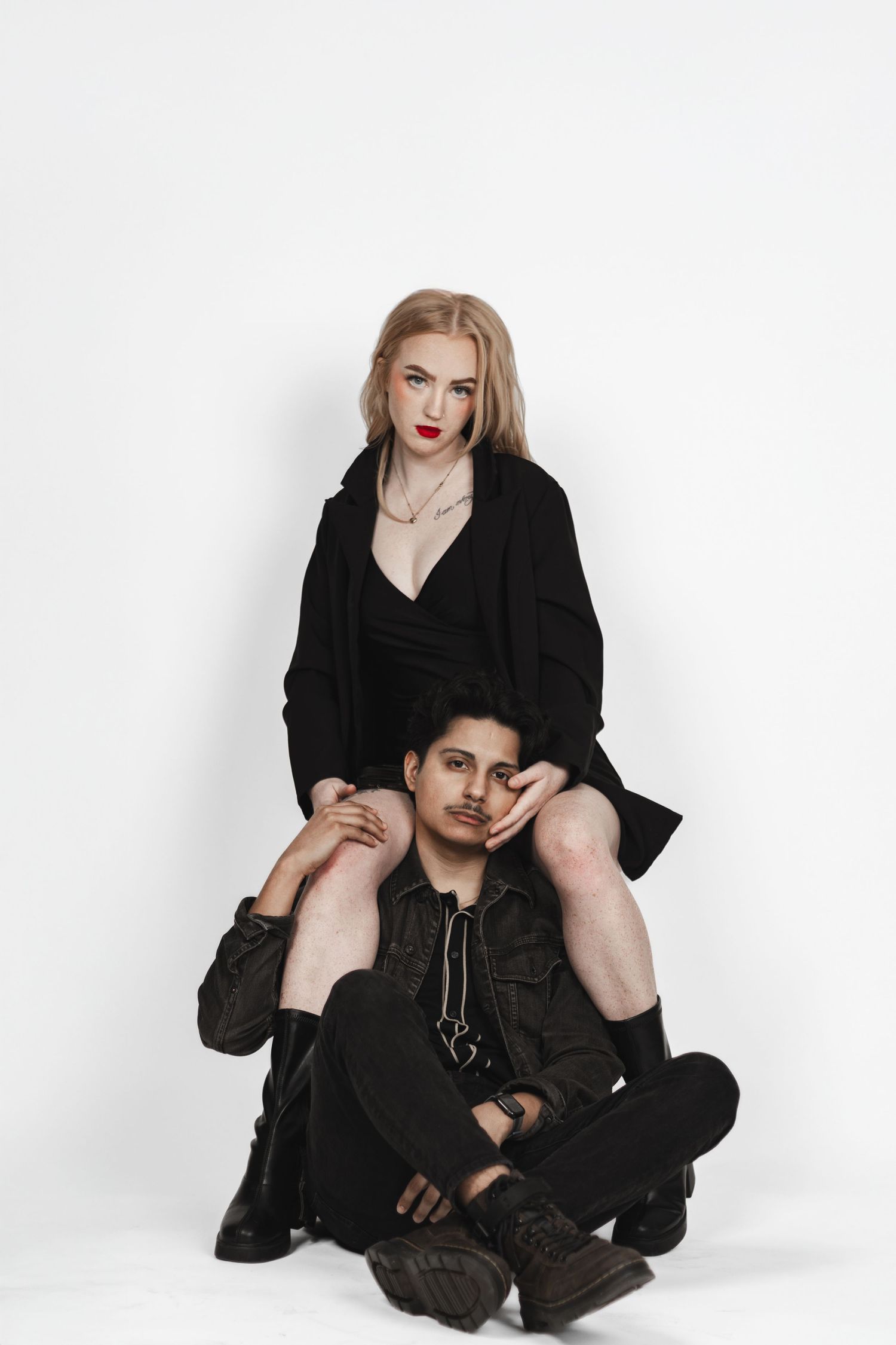 Artistic black and white studio portrait featuring edgy fashion styling.