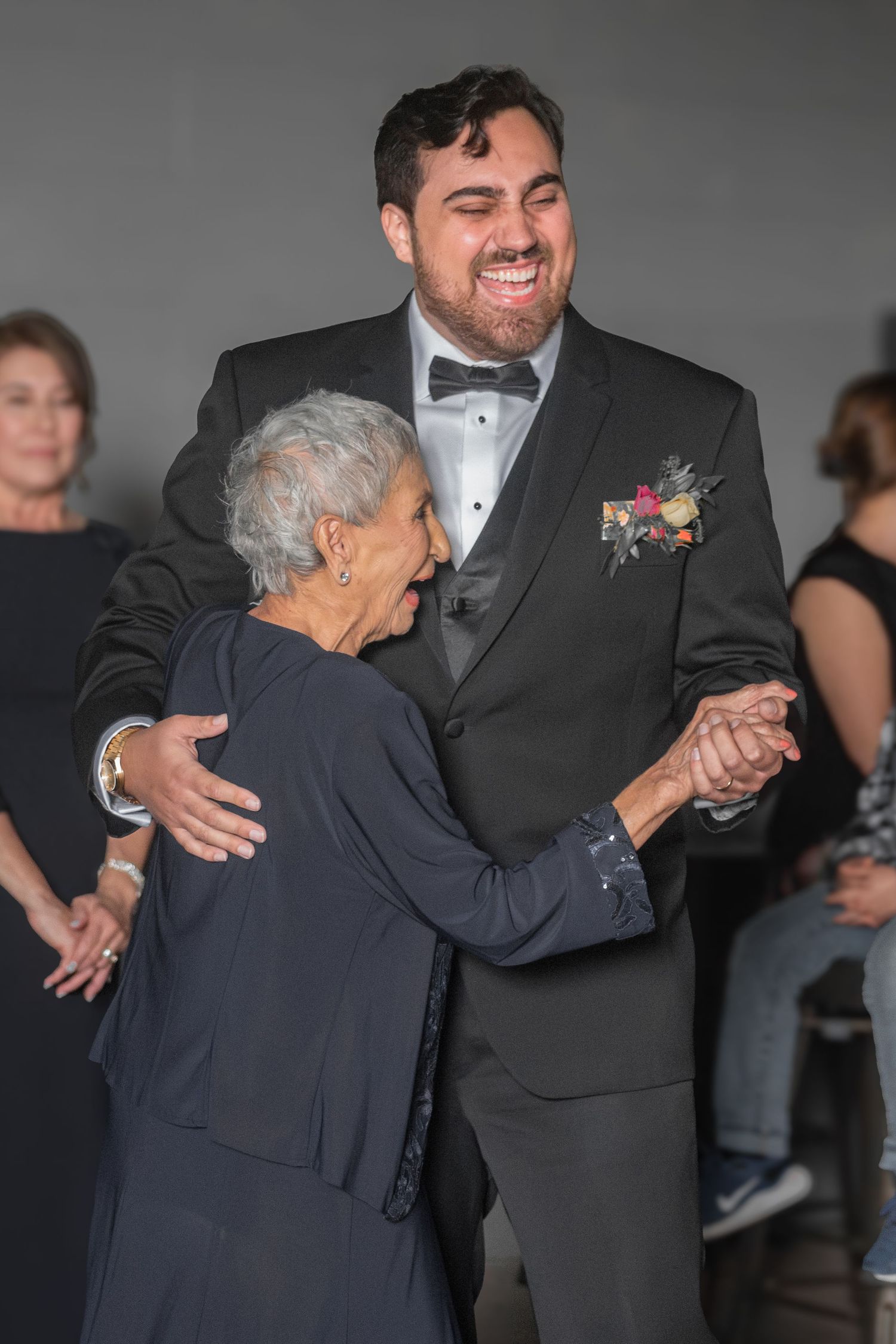 Two people sharing a dance moment at formal event at River North Icehouse in San Antonio, Texas.