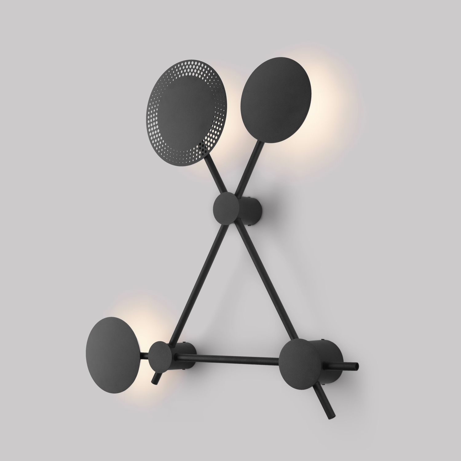 Contemporary black wall lamp with three circular light fixtures in triangular arrangement.