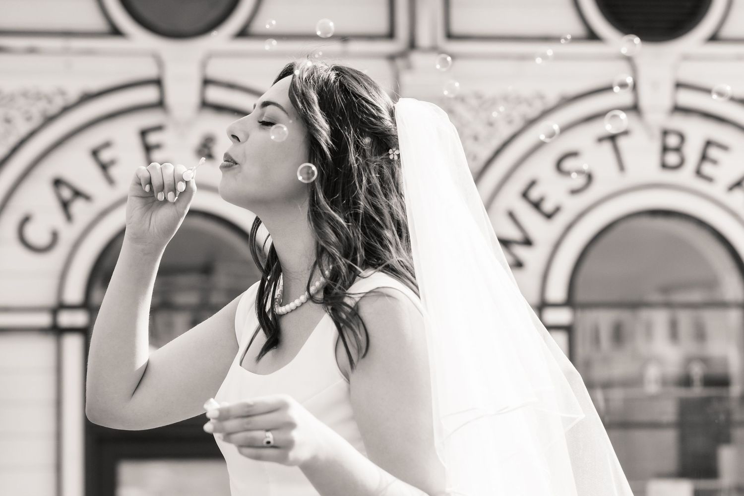 Black and white photos show a couple sharing intimate moments during their wedding celebration.