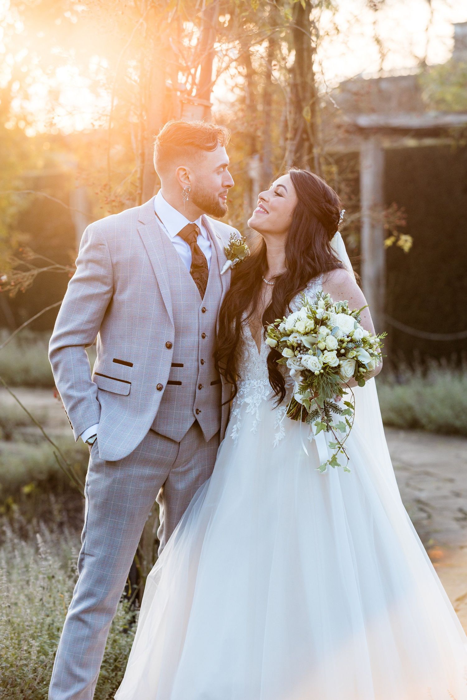 Jade and Richard’s intimate sunset close-up as a couple looking at each other, captured by Oisin Studios