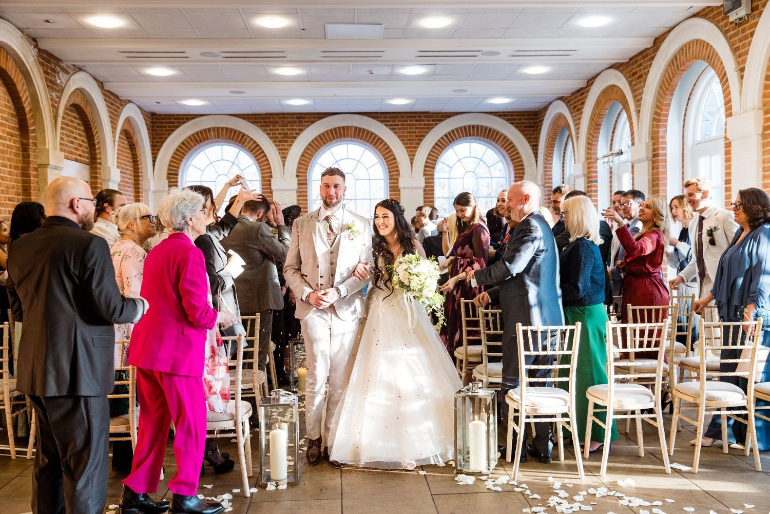 Couple walking down the aisle, captured by Oisin Studios — documentary wedding photography in London