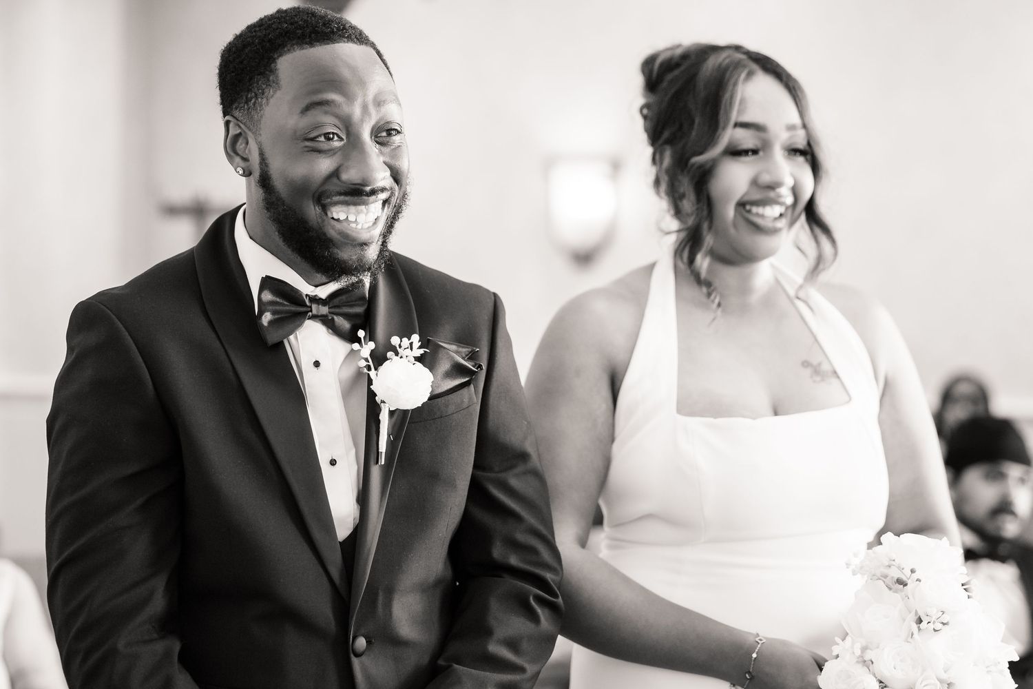 Black and white wedding photographs capture joyful candid moments during the ceremony and reception.