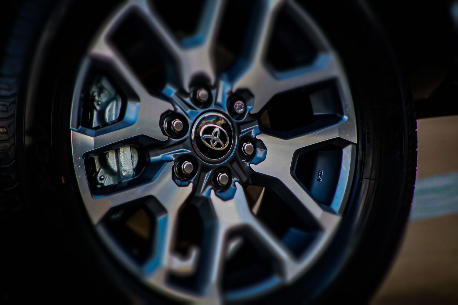 Detailed view of a Toyota wheel hub with modern split-spoke design.