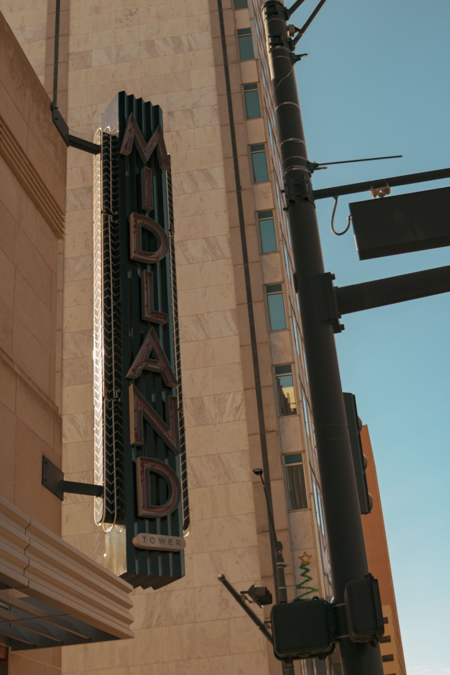 Vintage art deco Midland theater sign mounted on building exterior.