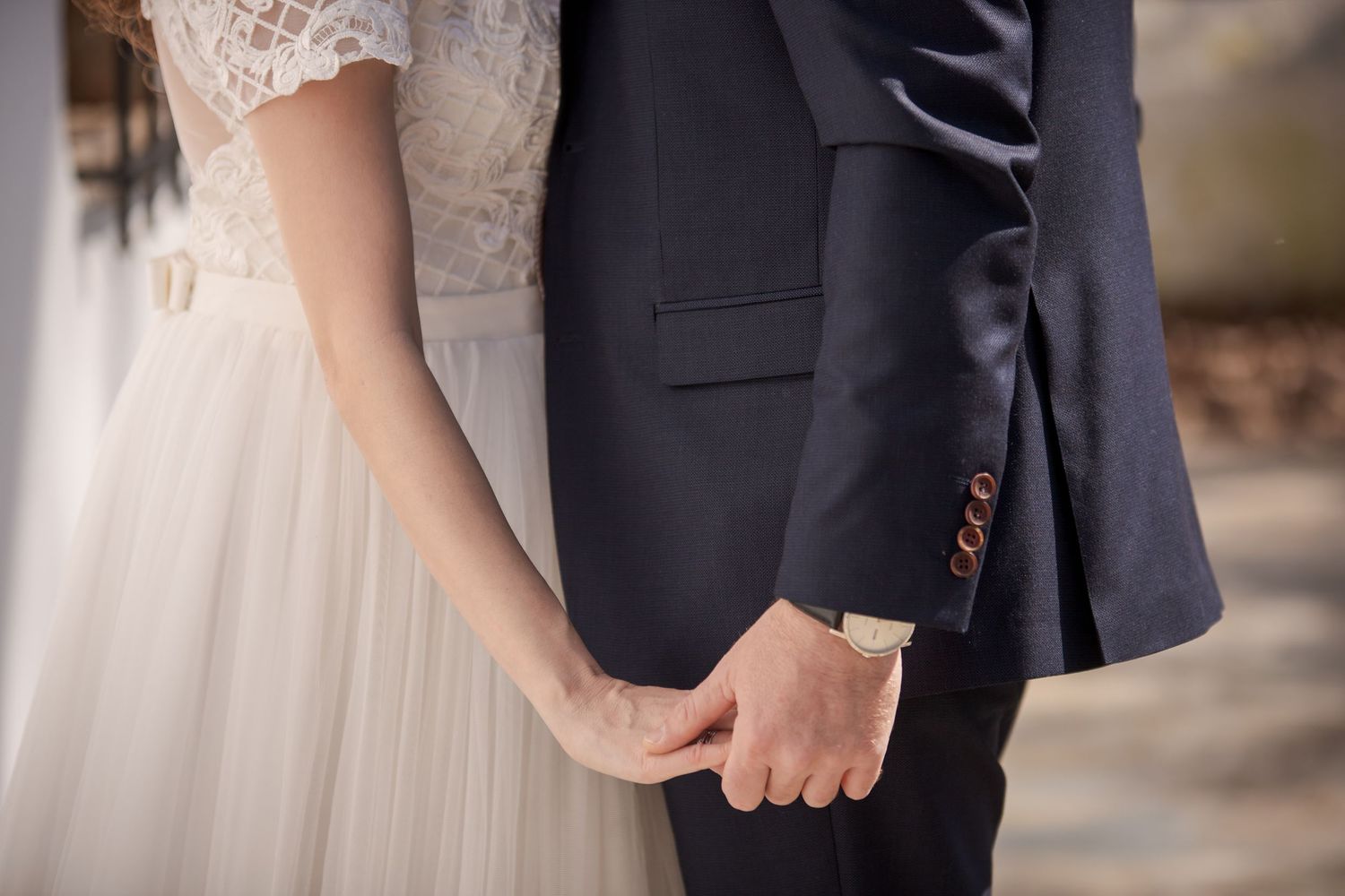 Elegant wedding detail shot focusing on formal attire and classic styling.