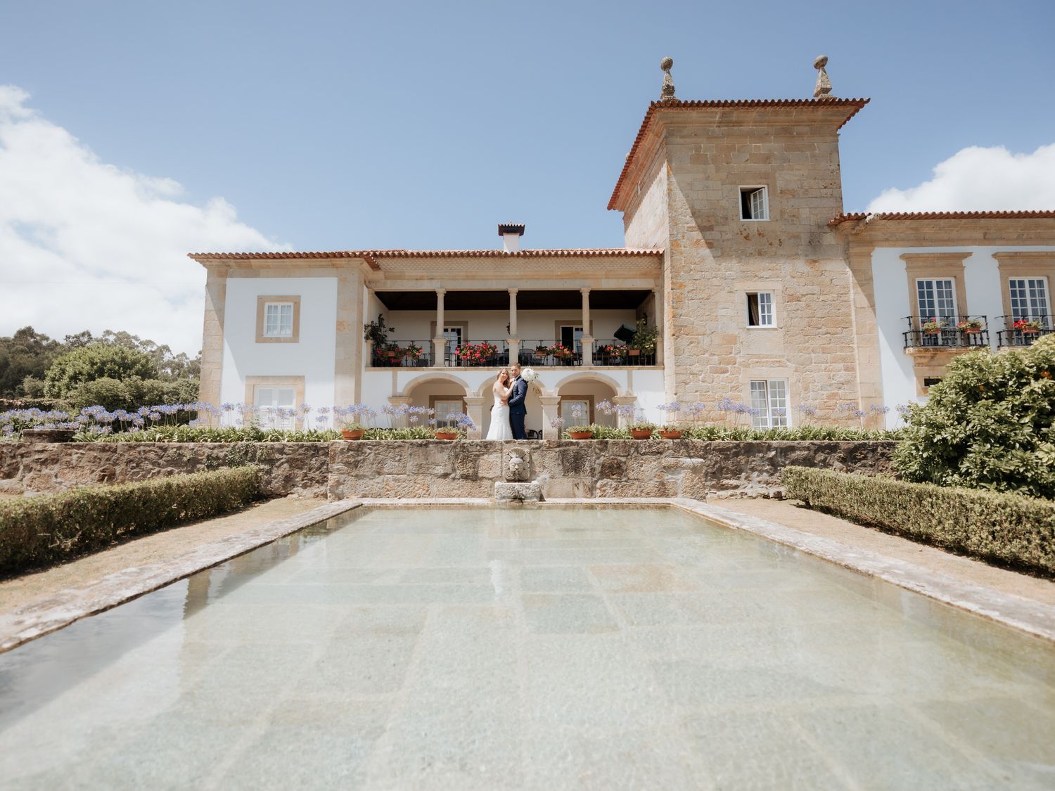 A series of minimalist architectural photographs showing a white Mediterranean style building with clean lines and archways.