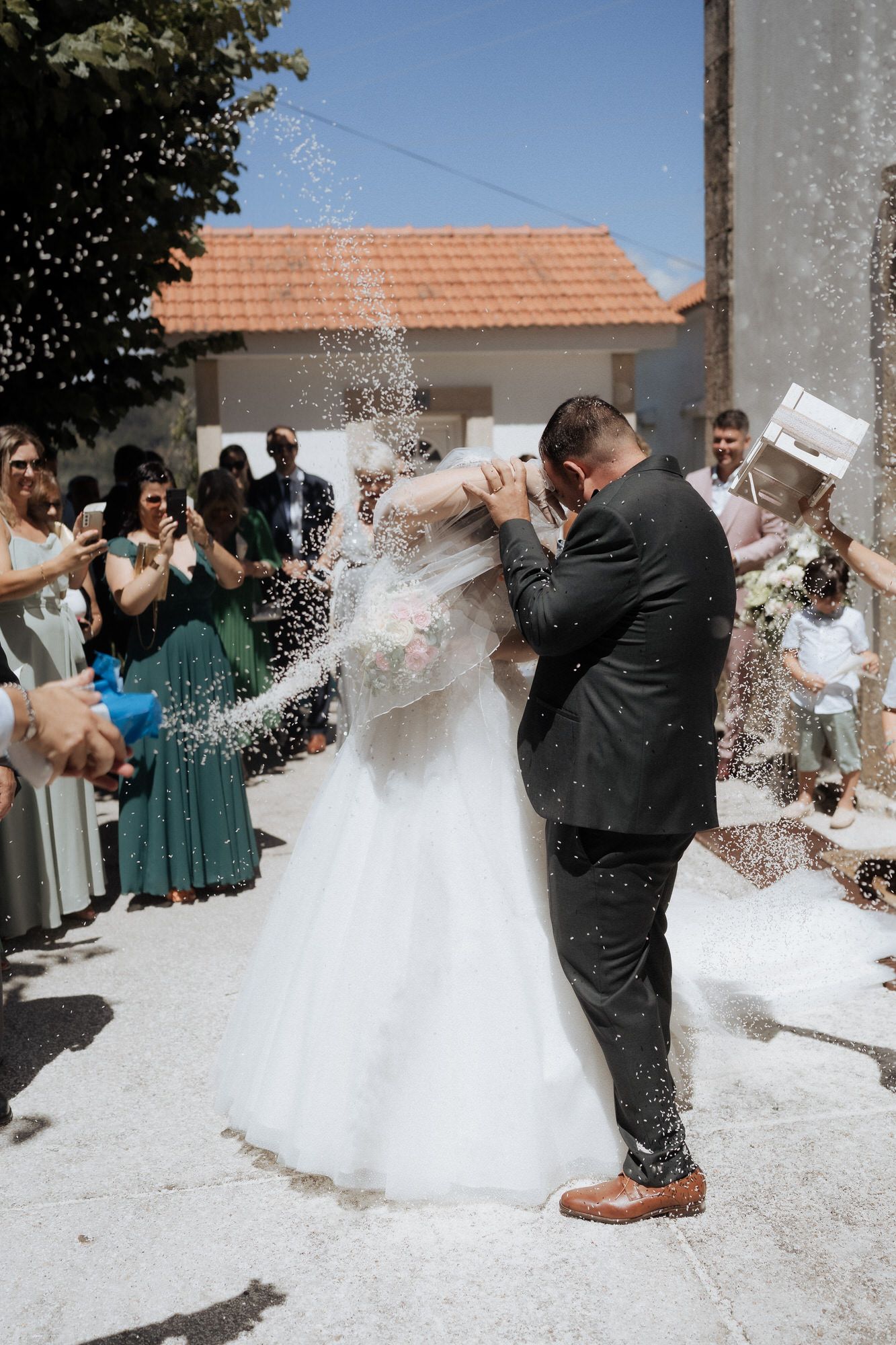 A sequence of wedding photos showing celebration with rice throwing as newlyweds exit the ceremony.