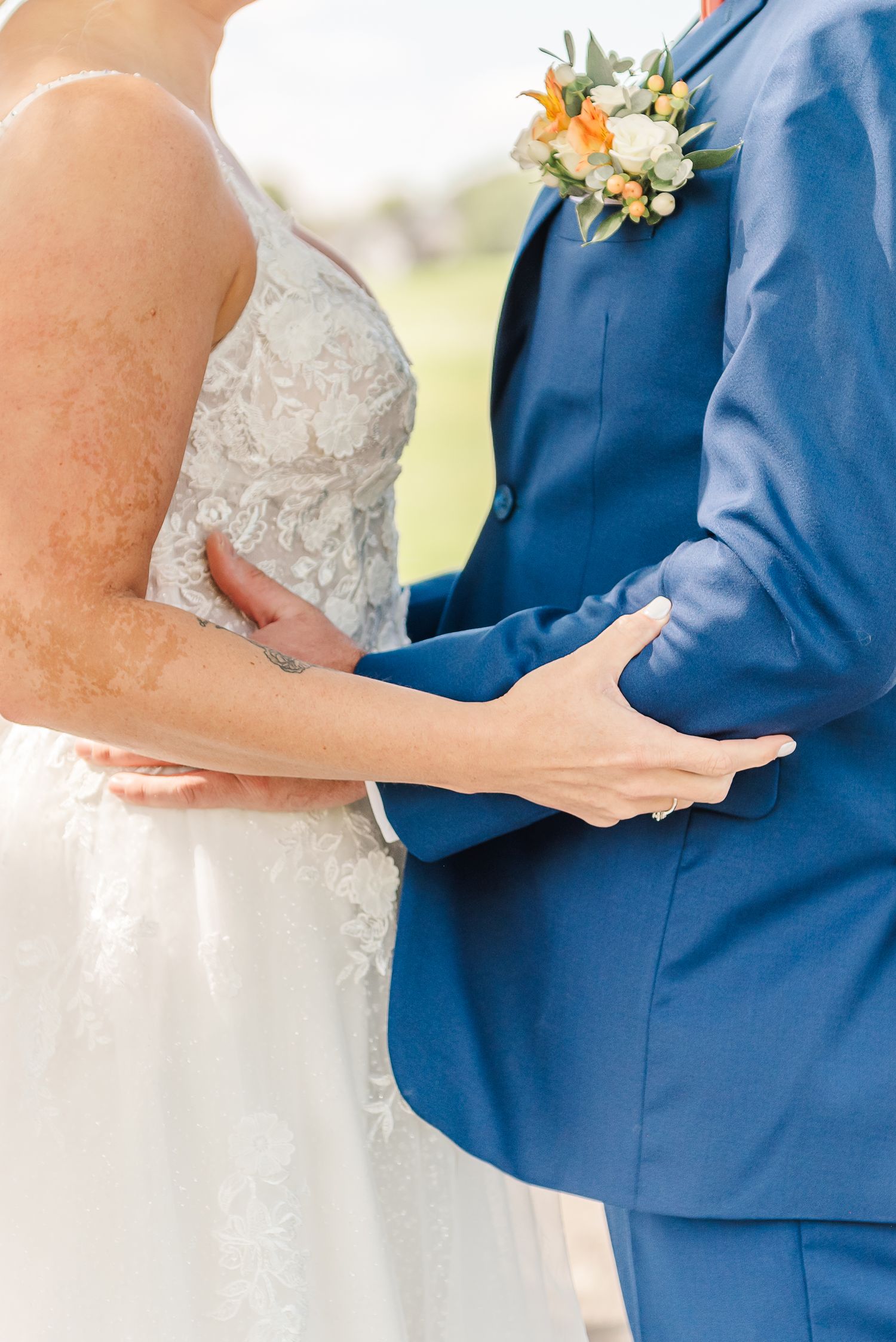 Close-up detail shots of a bride and groom exchanging vows during an outdoor wedding ceremony.