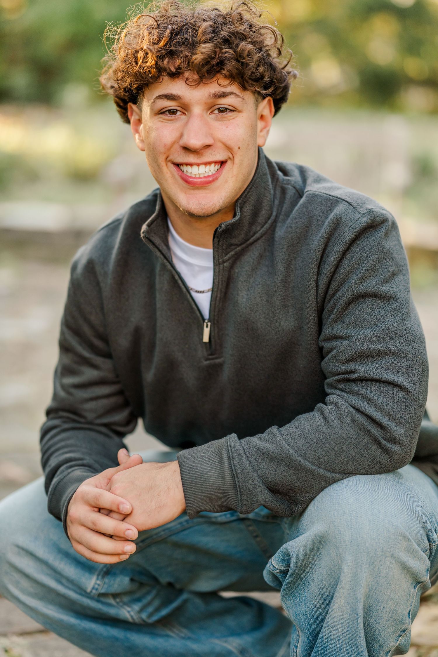 A series of candid outdoor portraits showing someone in a dark gray fleece jacket sitting and smiling warmly.