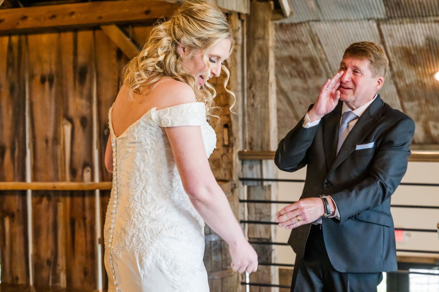 Candid moments captured during a rustic barn wedding first look with bride's dad. The Old Barns at Dry Run Farms in Williamsport, OH.